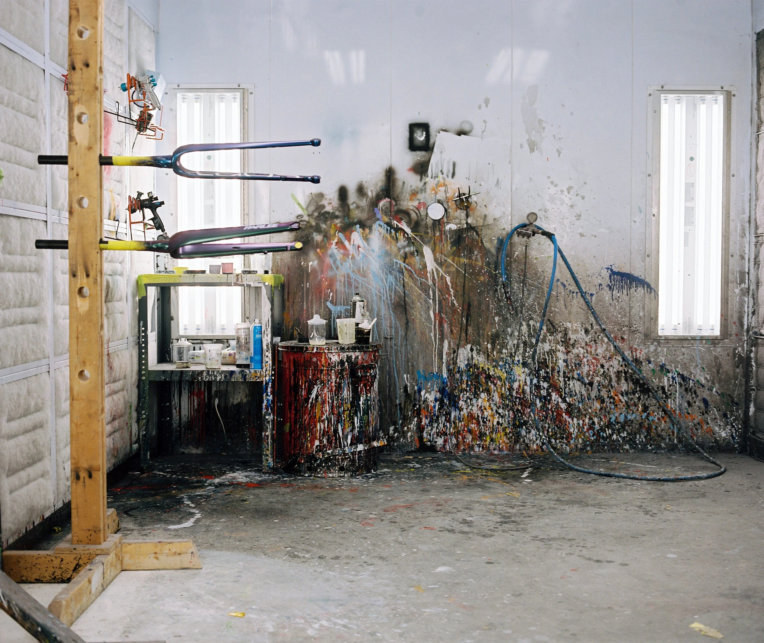 freshly painted forks dry in the paint booth at Parlee headquarters