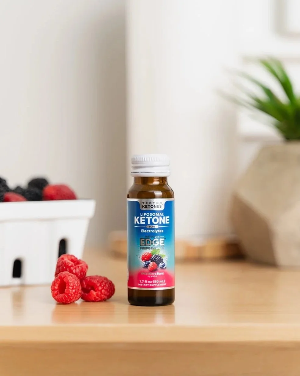 Tecton Ketones lifestyle product image for dietary suplement. Product hero photo in a lifestyle kitchen setting with berries and ingredients nearby and natural plant elements. In collaboration with Atlanta marketing agency Yellowdog Media.