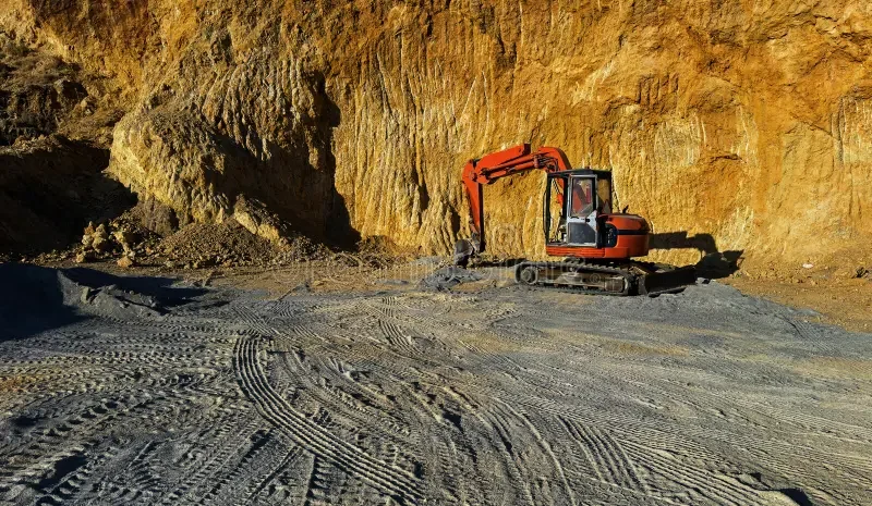 excavator-working-quarry-excavator-working-quarry-site-rocky-cliff-tire-tracks-ground-403765835.webp