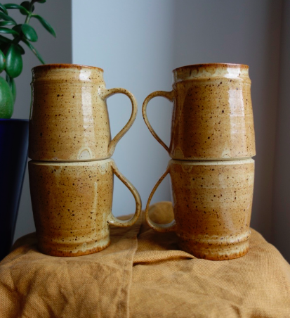 four pottery mugs