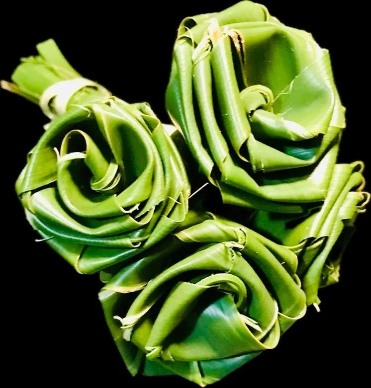 Handwoven palm frond roses for Christian sympathy or church offering