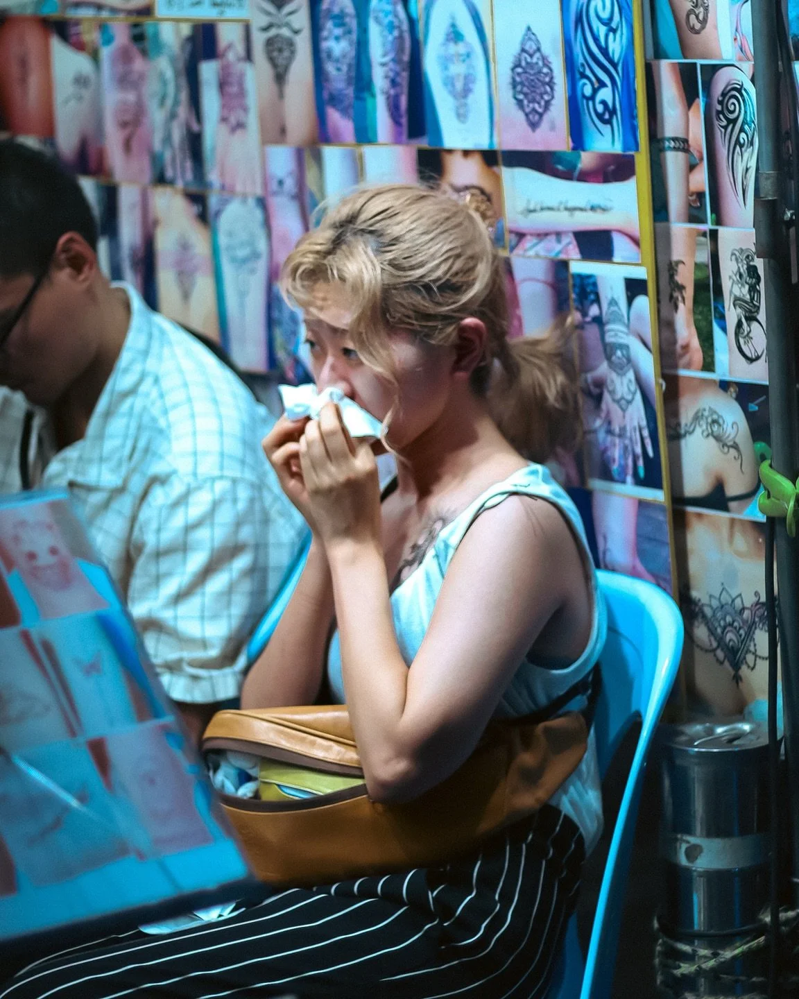 Zooming into lives and mannerisms is like directing your own little movie, making strangers the protagonist in your shot. Romanticising a composition and recording passing moments for open interpretation. 

I found this woman adorable and sweet, as s