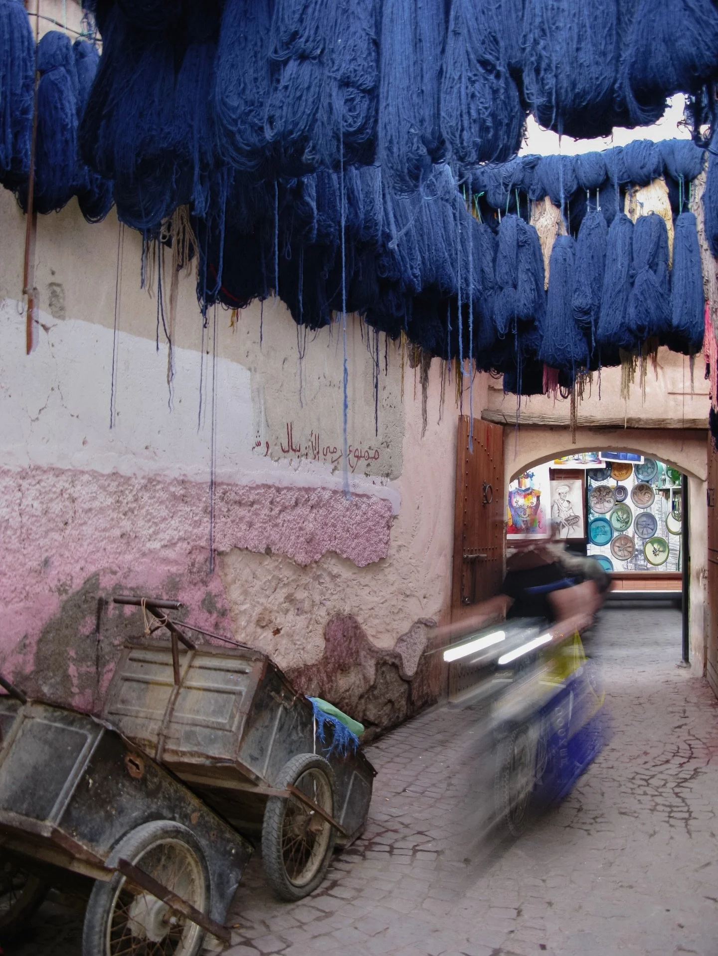 Deep inside the Souks of Marrakesh and all the colours!!! All the raw fibers from cactus plants are hung down and exhibited from the roofs. Naturally dyed from saffron and indigo waiting to be crafted into scarfs, cushions, blankets in corners of all