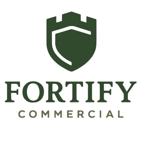 Logo of Fortify Commercial featuring a shield with a battlement top and the words "Fortify Commercial" below.