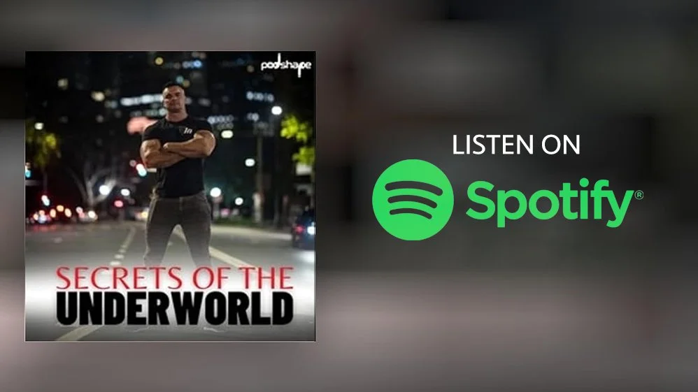 Podcast cover art titled 'Secrets of the Underworld' featuring a man standing with crossed arms on a city street at night, with a background of blurred city lights and trees. Text on the right indicates it is available on Spotify.