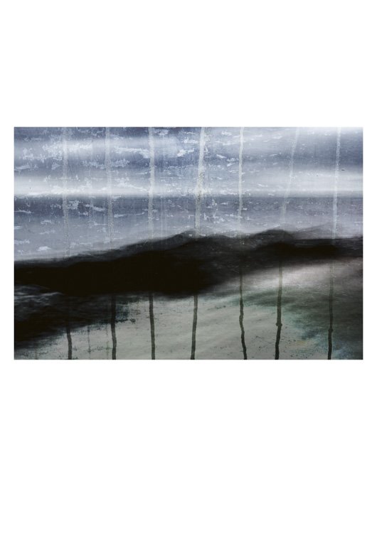 subjective-view-rainy-window Frabkie McAllister has made this image of seagrass and black rocks, with a distant iron blue sea and lines of rain trickling down as if from a window pain.