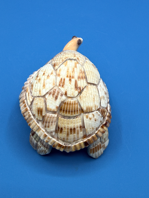 Handcrafted small sea turtle sculpture made from natural ocean materials