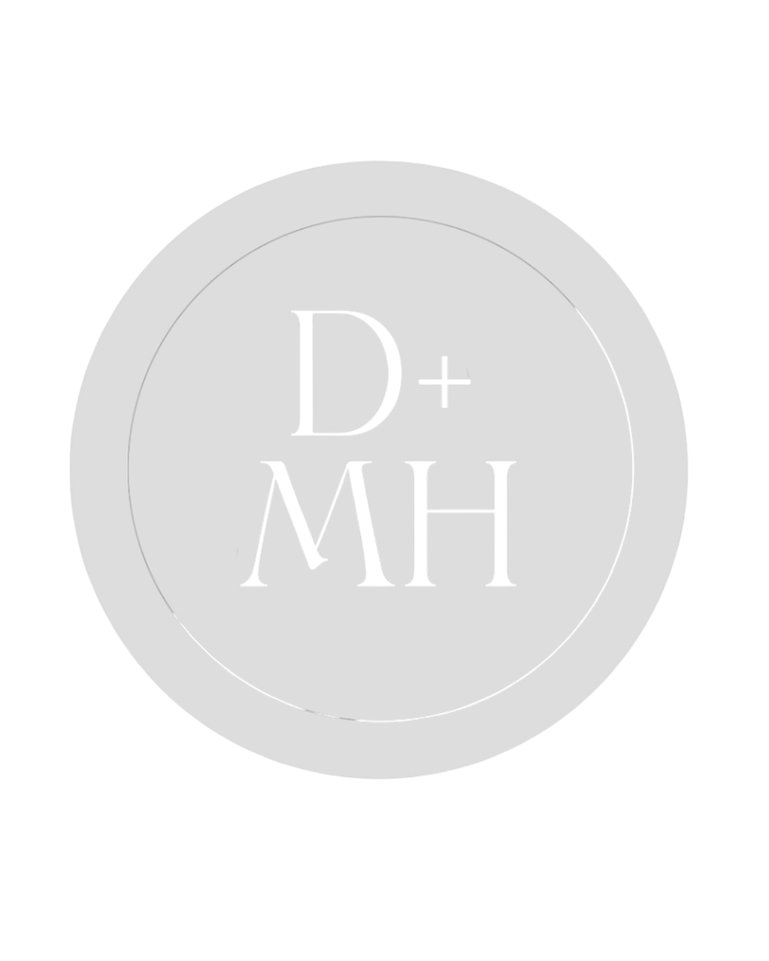 Close-up of a white circle with the letters D+MH engraved inside it.