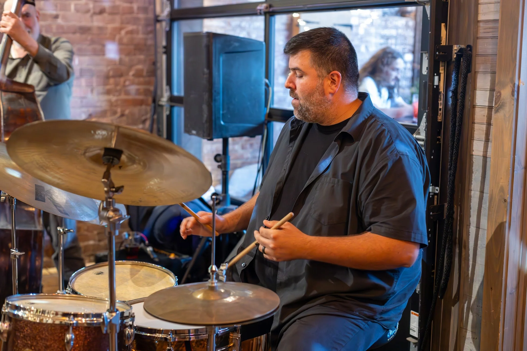 Live jazz drummer performing at Here & Now Brewing Company in Honesdale PA during Thursday night jazz event.