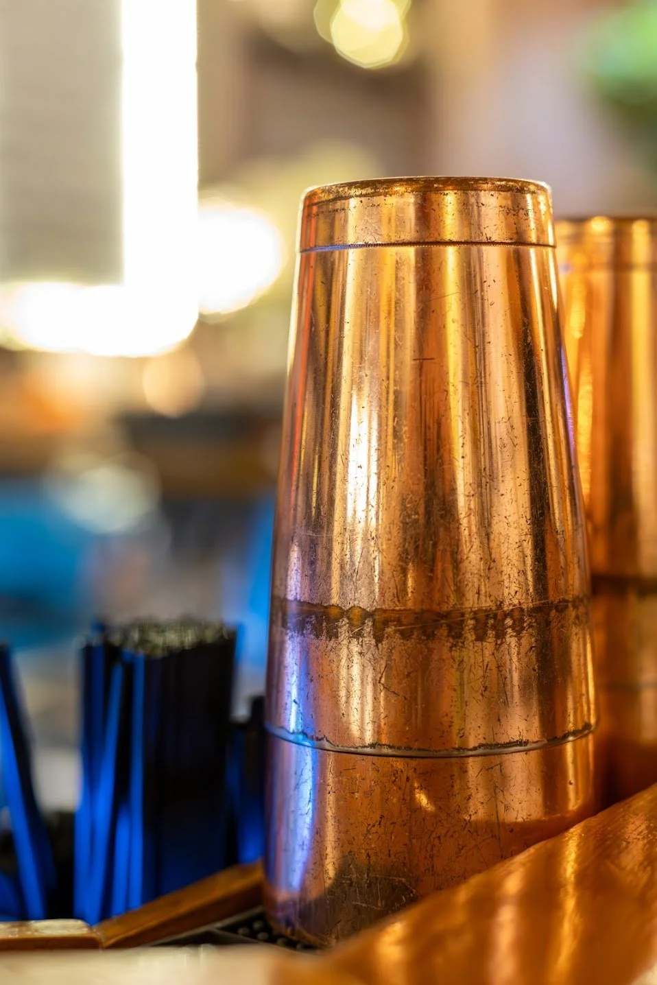 a copper cocktail shaker in a bar setting at here and now brewing company in honesdale pa