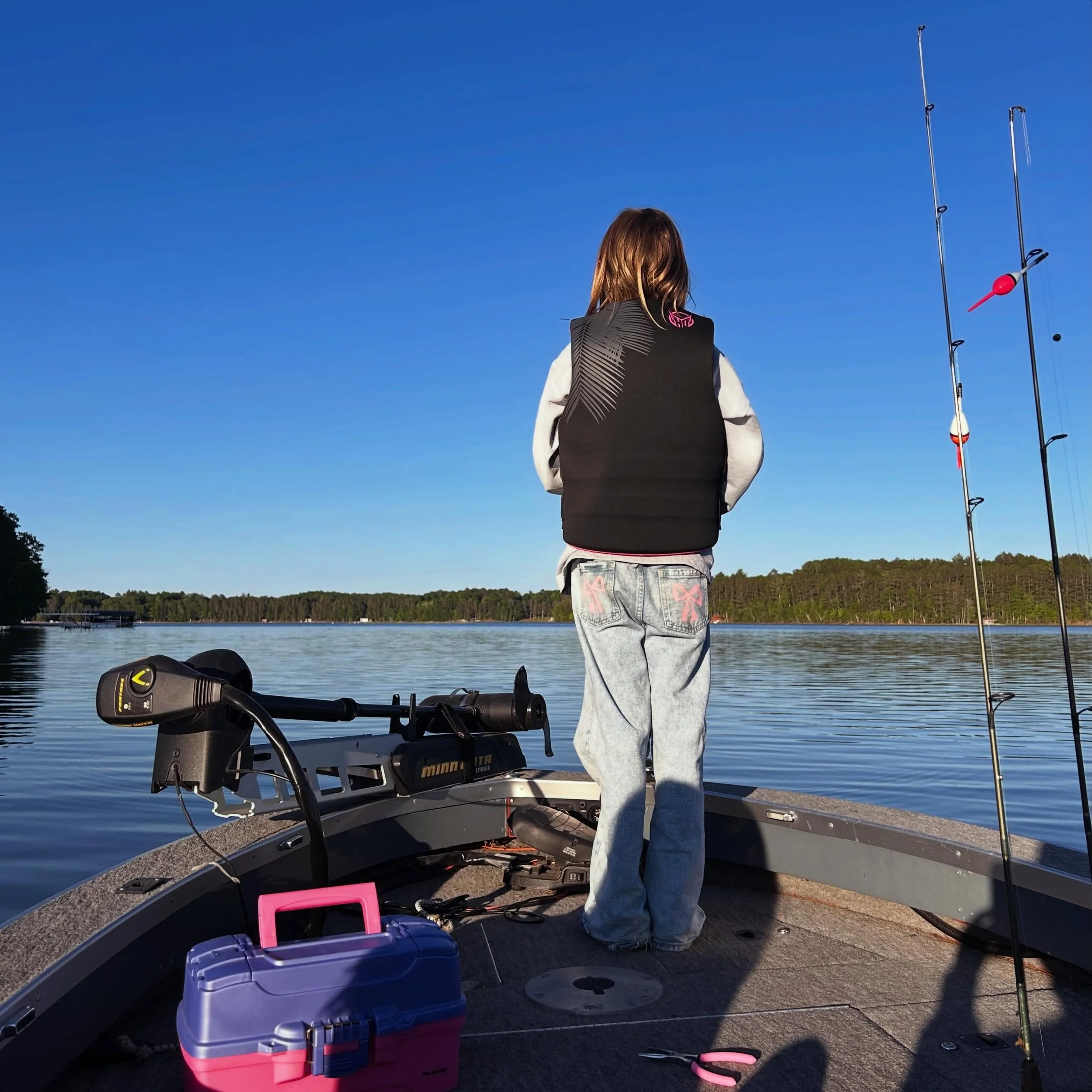 Lake days are upon us. ☀️Nothing says &ldquo;Wisco Girl&rdquo; quite like reeling in your catch at 8pm in your pink bow denim pants and pink lifejacket 🎀

(She caught two fish; one of which was a monster bluegill named Jimmy Bob&hellip; he rode in a