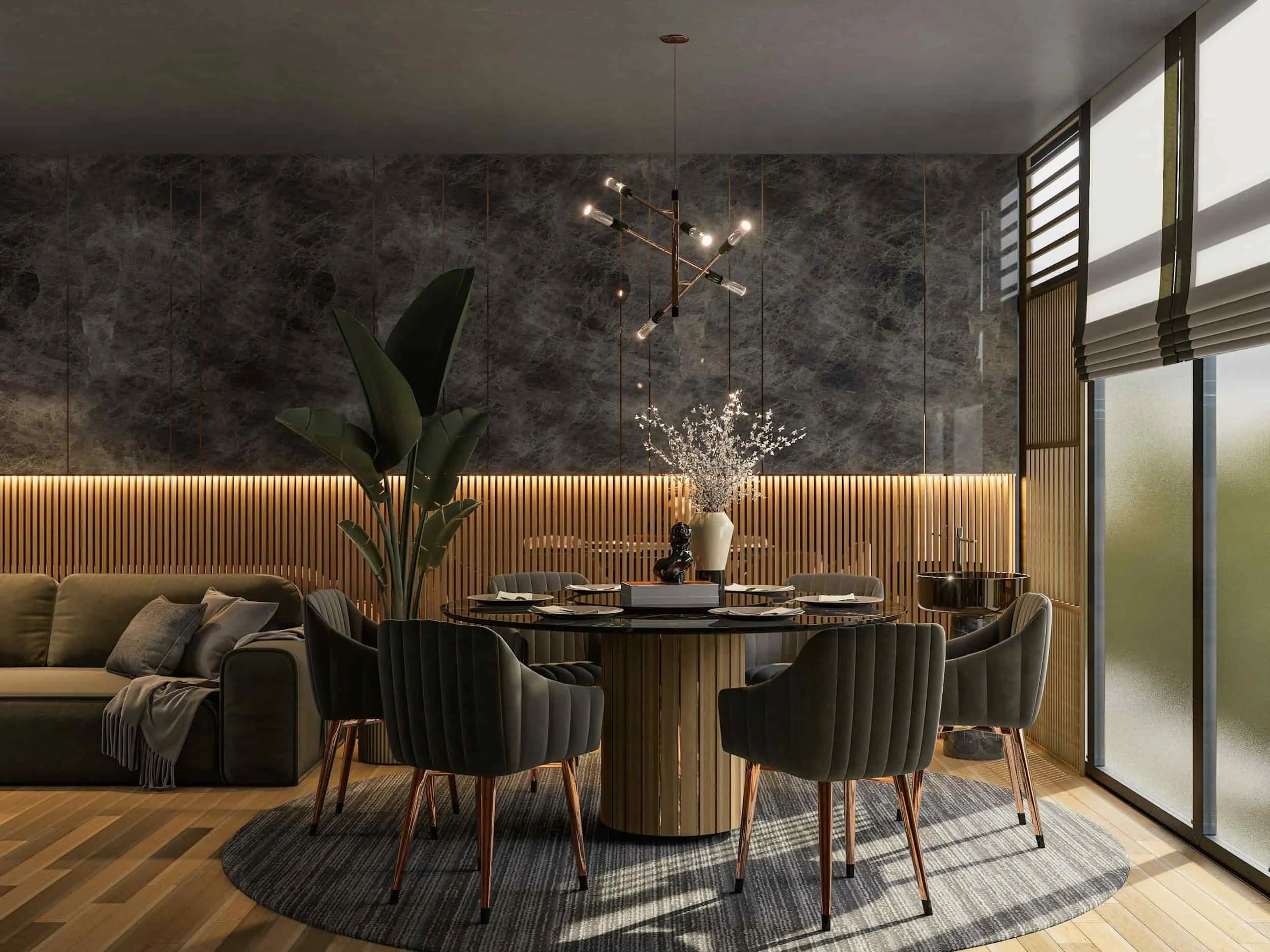 Modern dining room with a round table, green chairs, a plant, stylish lighting, and soft natural light from large windows.