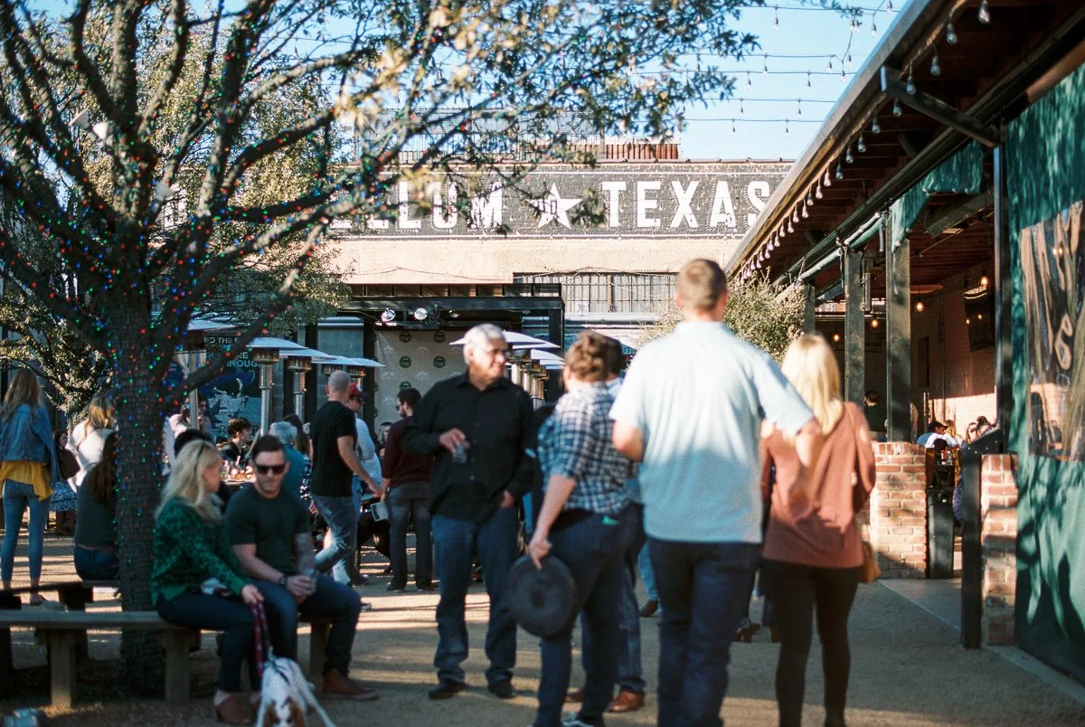Crowds around a small collection of independent businesses in Dallas, Texas.