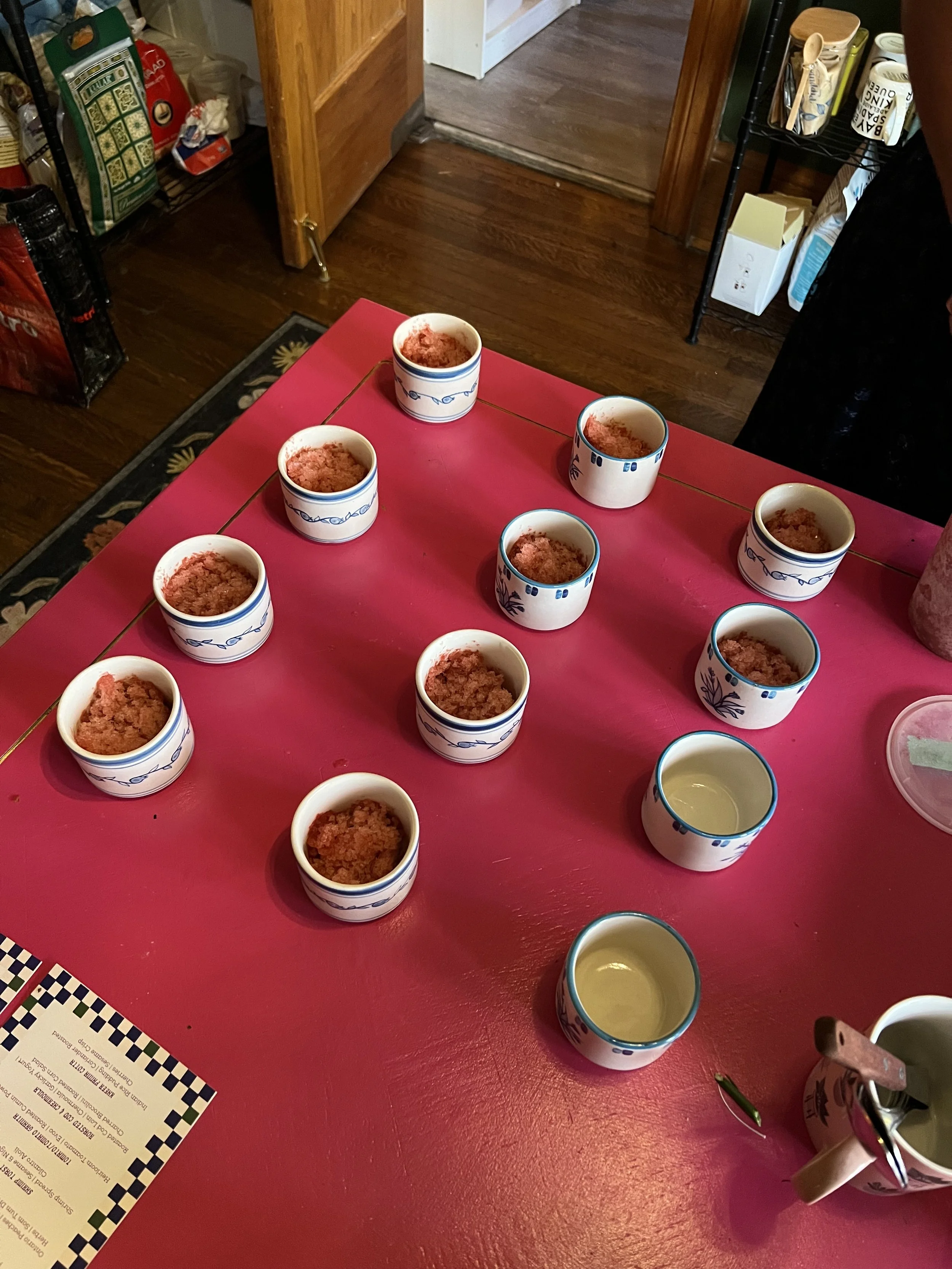 STUDIO PURANI cappuccino cups being plated at a supper club collaboration — hand-painted ceramic cups styled for entertaining