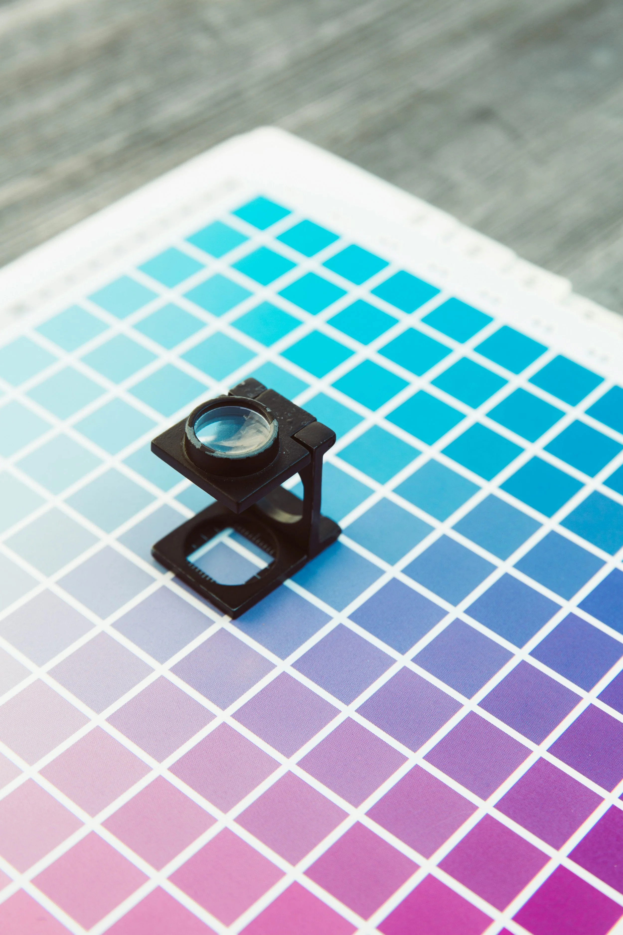 Color calibration chart with a magnifier and lens.
