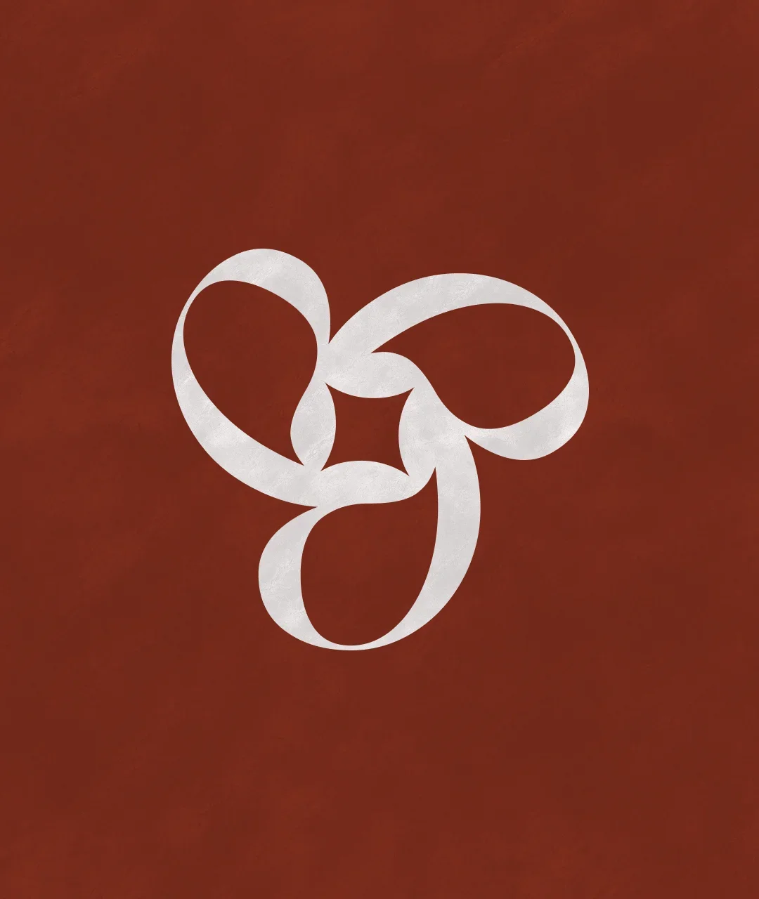 Un motif blanc en forme de chaîne de boucles sur un fond brun.