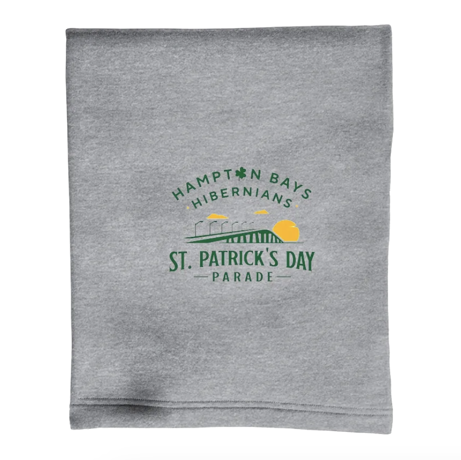 Gray fabric with a green and yellow logo for Hampton Bays Hibernians St. Patrick's Day Parade, featuring a bridge, clouds, and a yellow sun.
