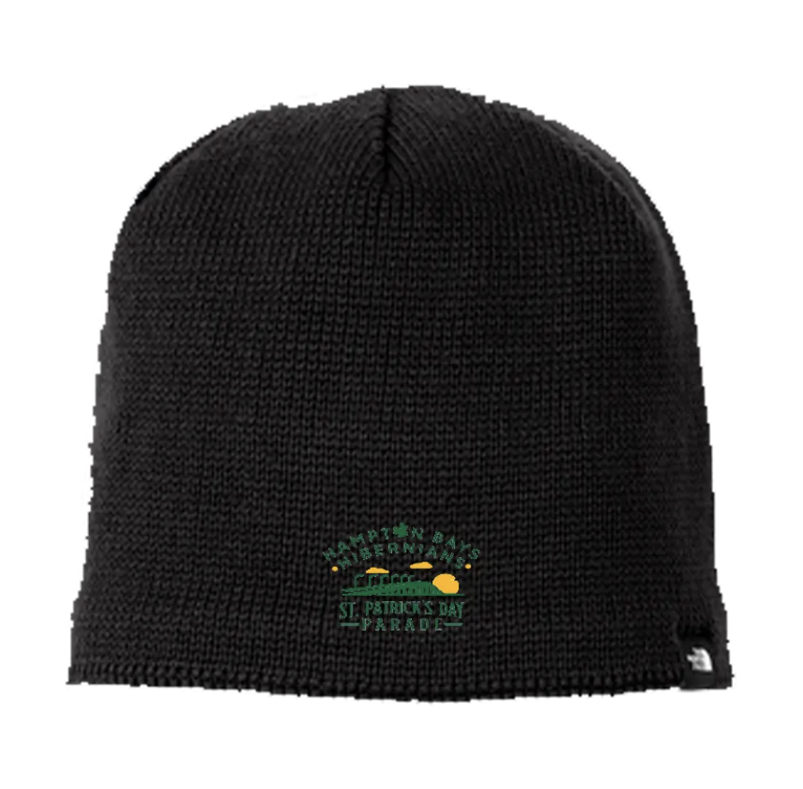 Black knit beanie hat with St. Patrick's Day Parade logo embroidered in green, yellow, and black.