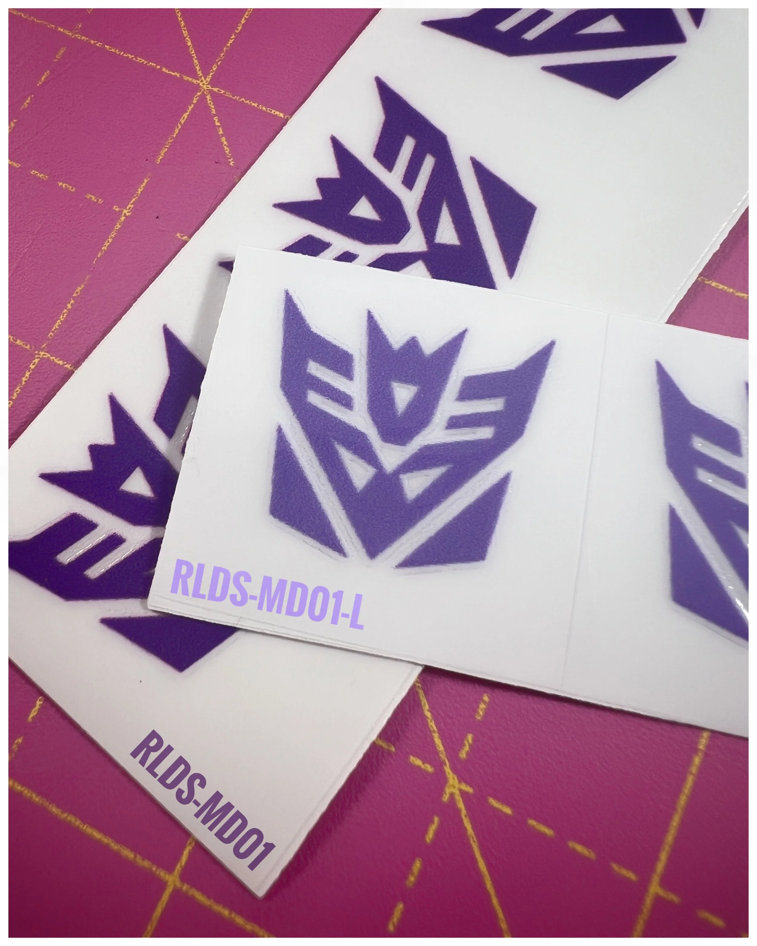 6 x medium toon style Con dry rub transfers, Light Purple with Clear background.