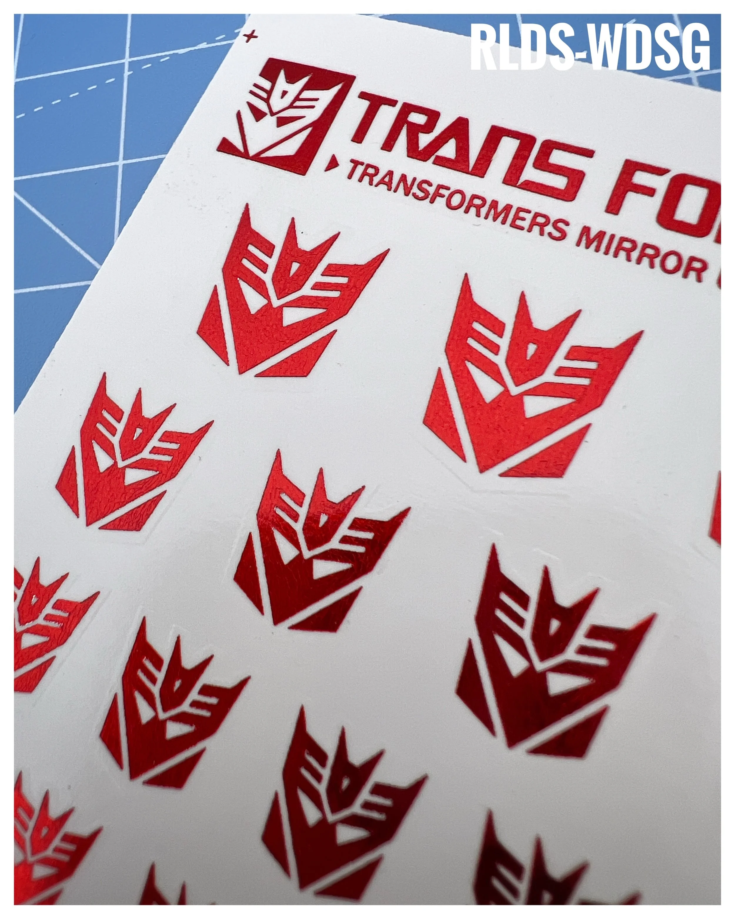 45 x Con Shattered Glass Water Slide decals, Metallic Red with Clear background.