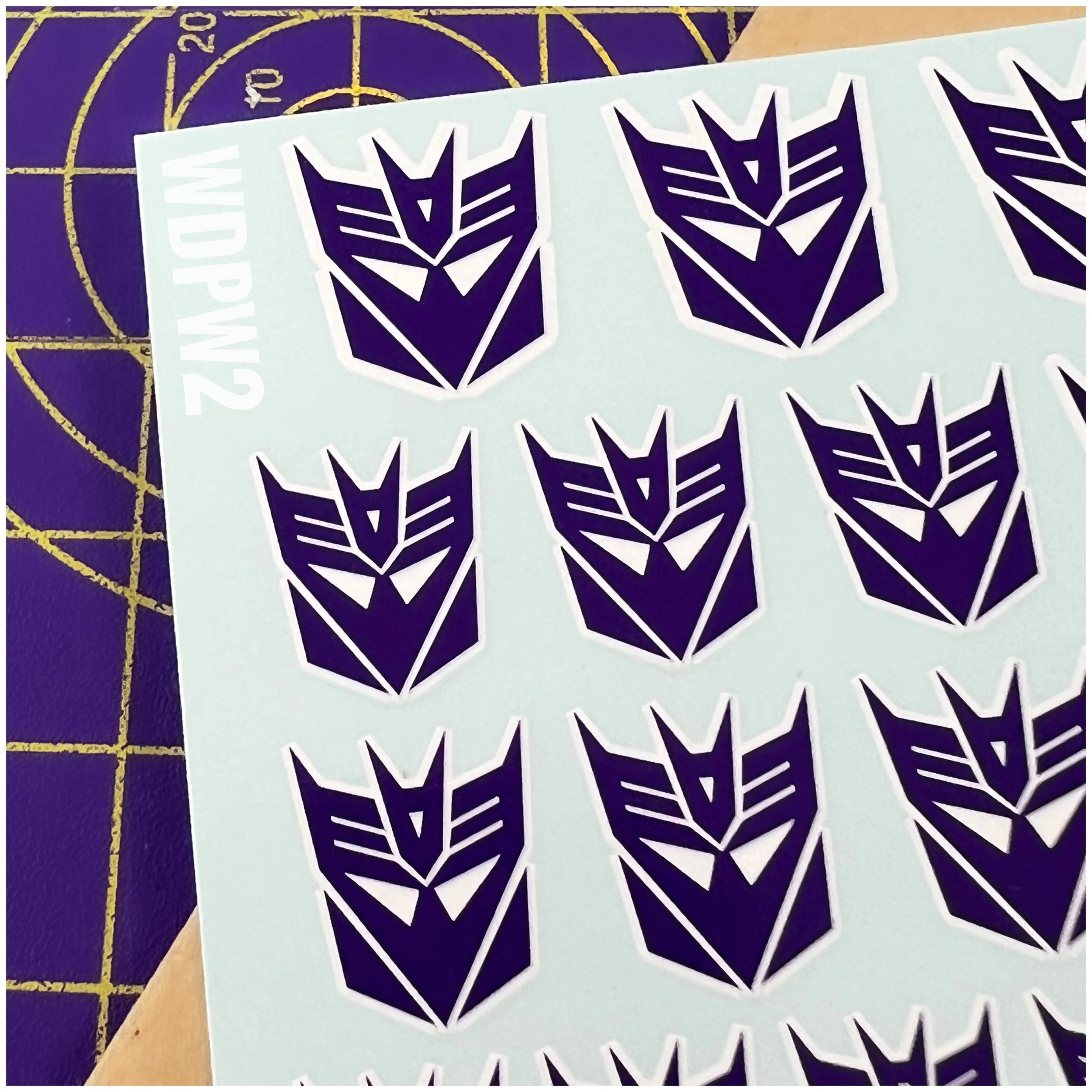 109 x Ocean Designs toy style Decepticon Water Slide decals, Purple with White background