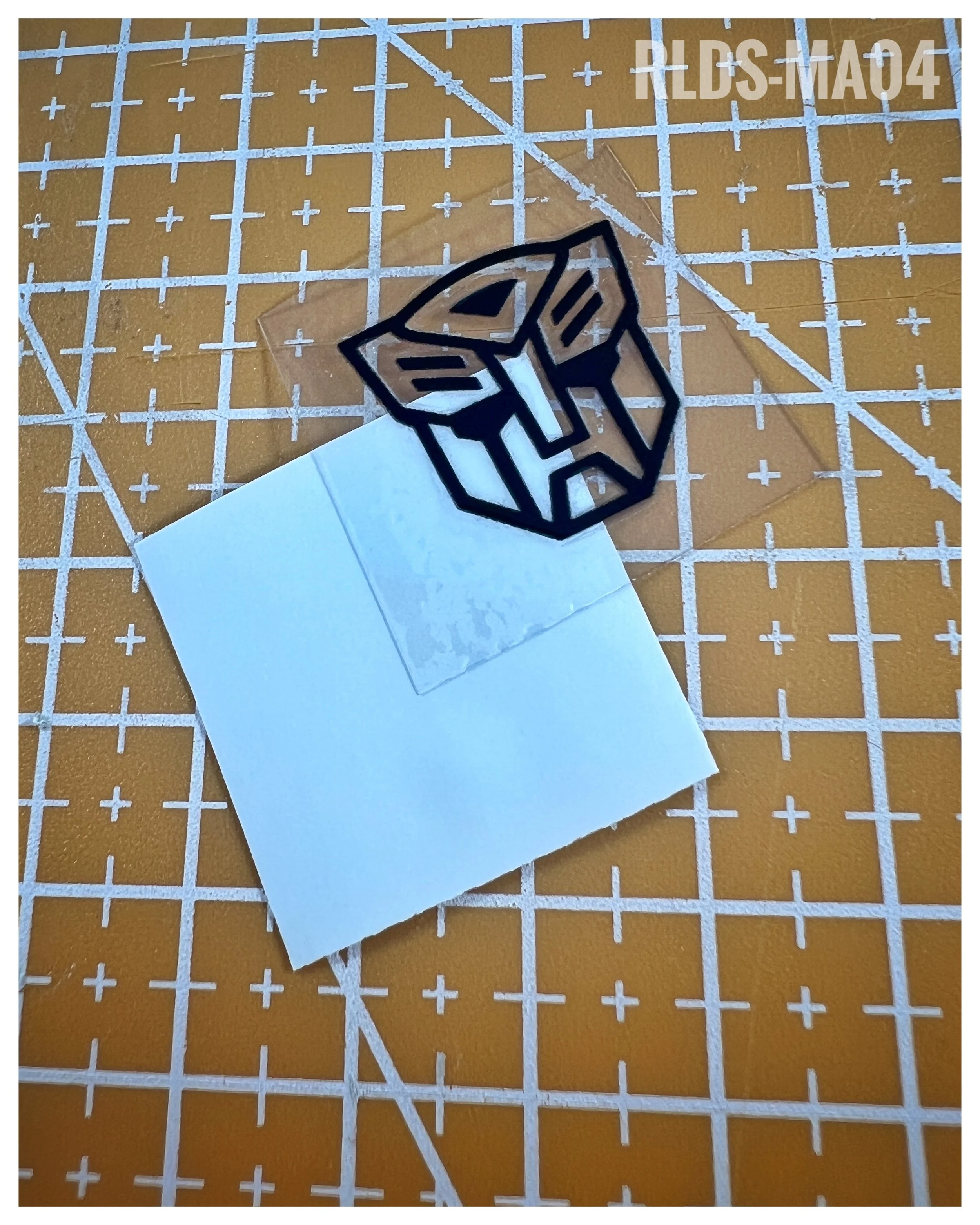 6 x medium 3D/raised toon style Bot dry rub transfers, Black Outline with Clear background.