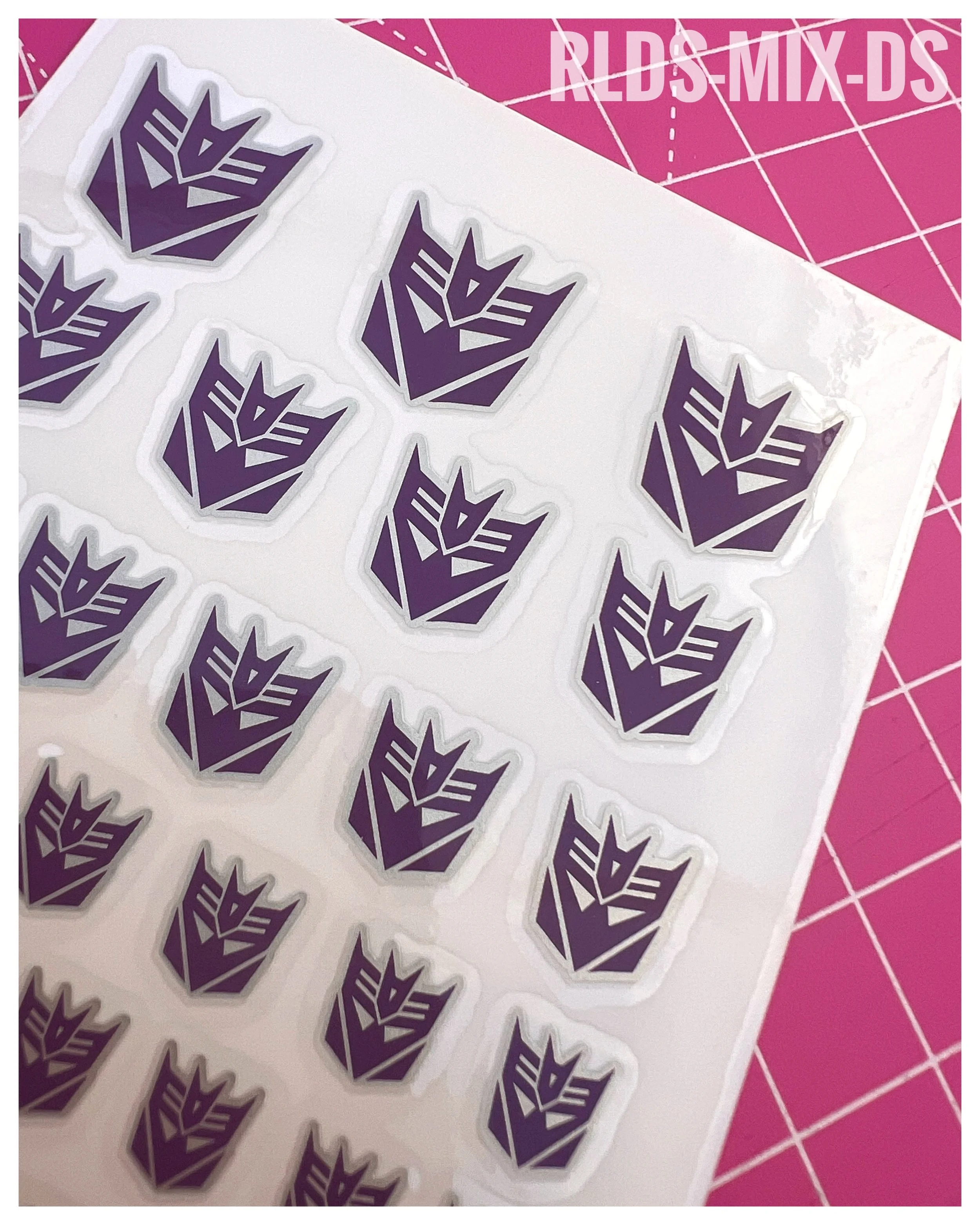 94 x Con dry rub transfers, including 12 x split logos, Purple with Silver background