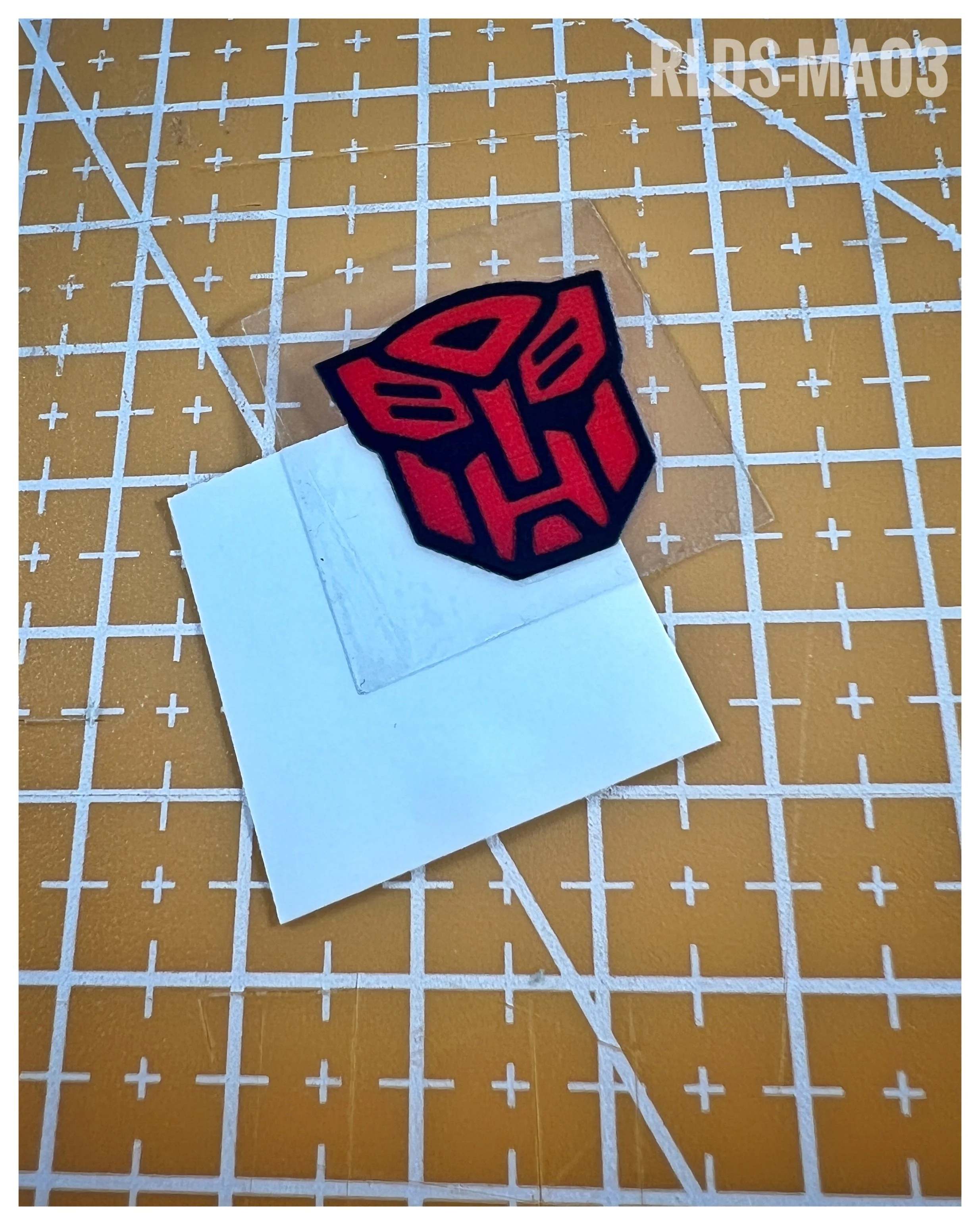 6 x medium 3D/raised toon style Bot dry rub transfers, Red with Black background.