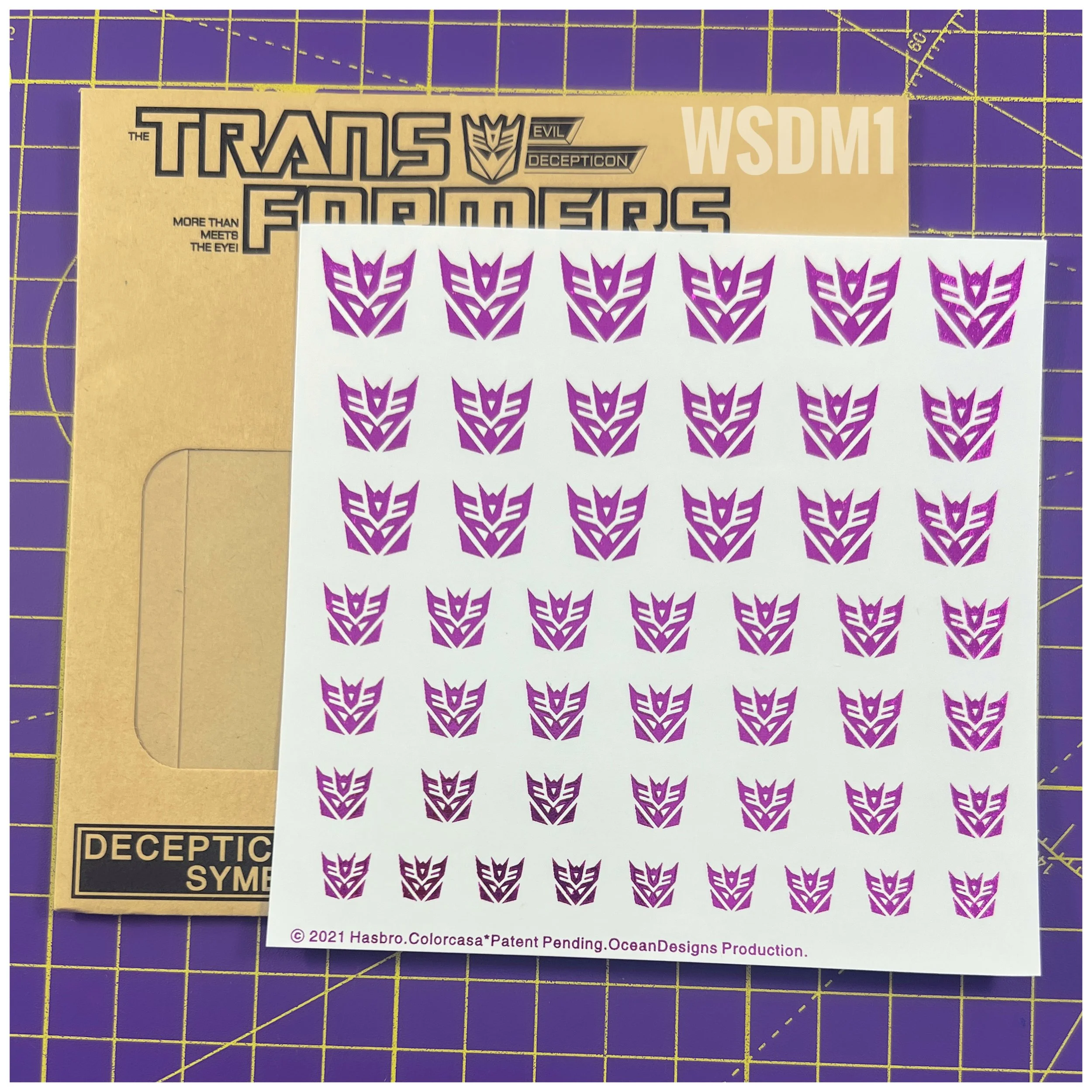 48 x Con Water Slide decals, Metallic Purple with Clear background.