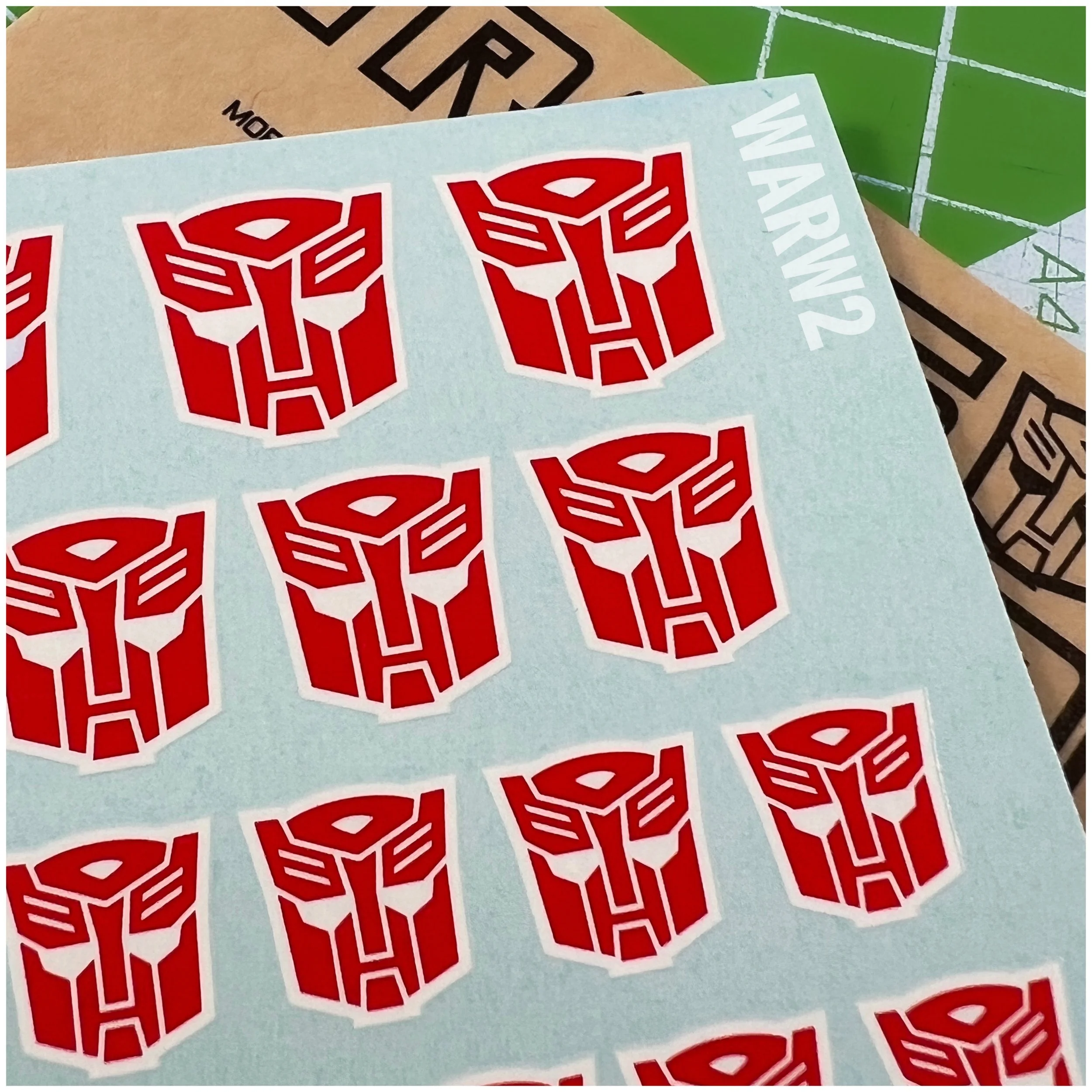 107 x Ocean Designs toy style Autobot Water Slide decals, Red with White background