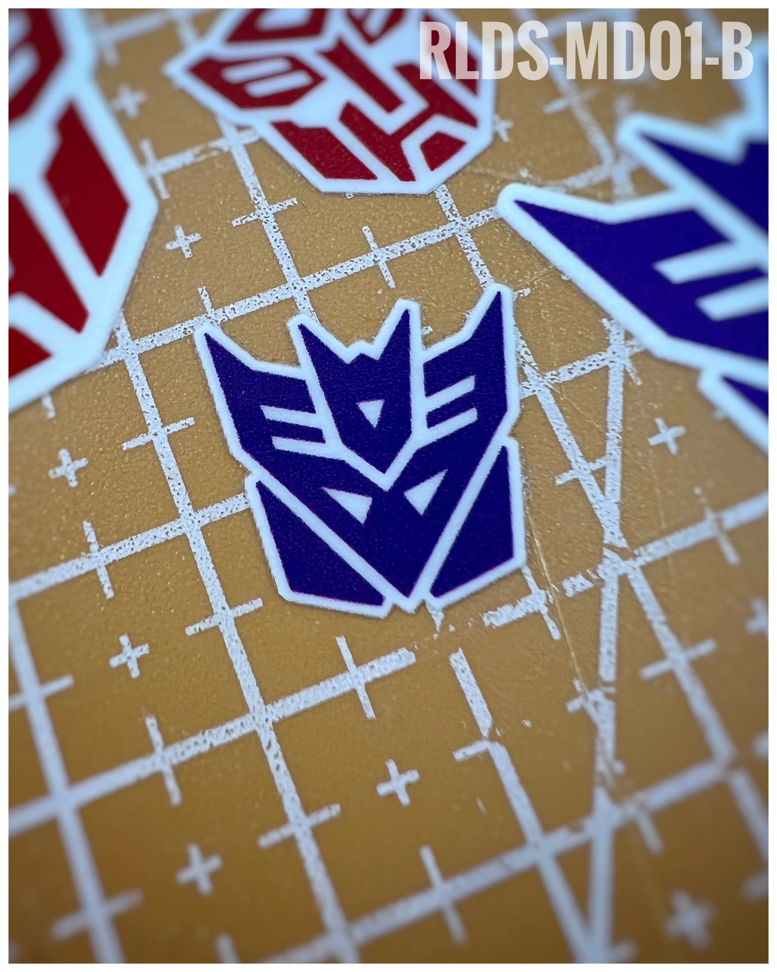 6 x medium toon style Con dry rub transfers, Purple with White background.