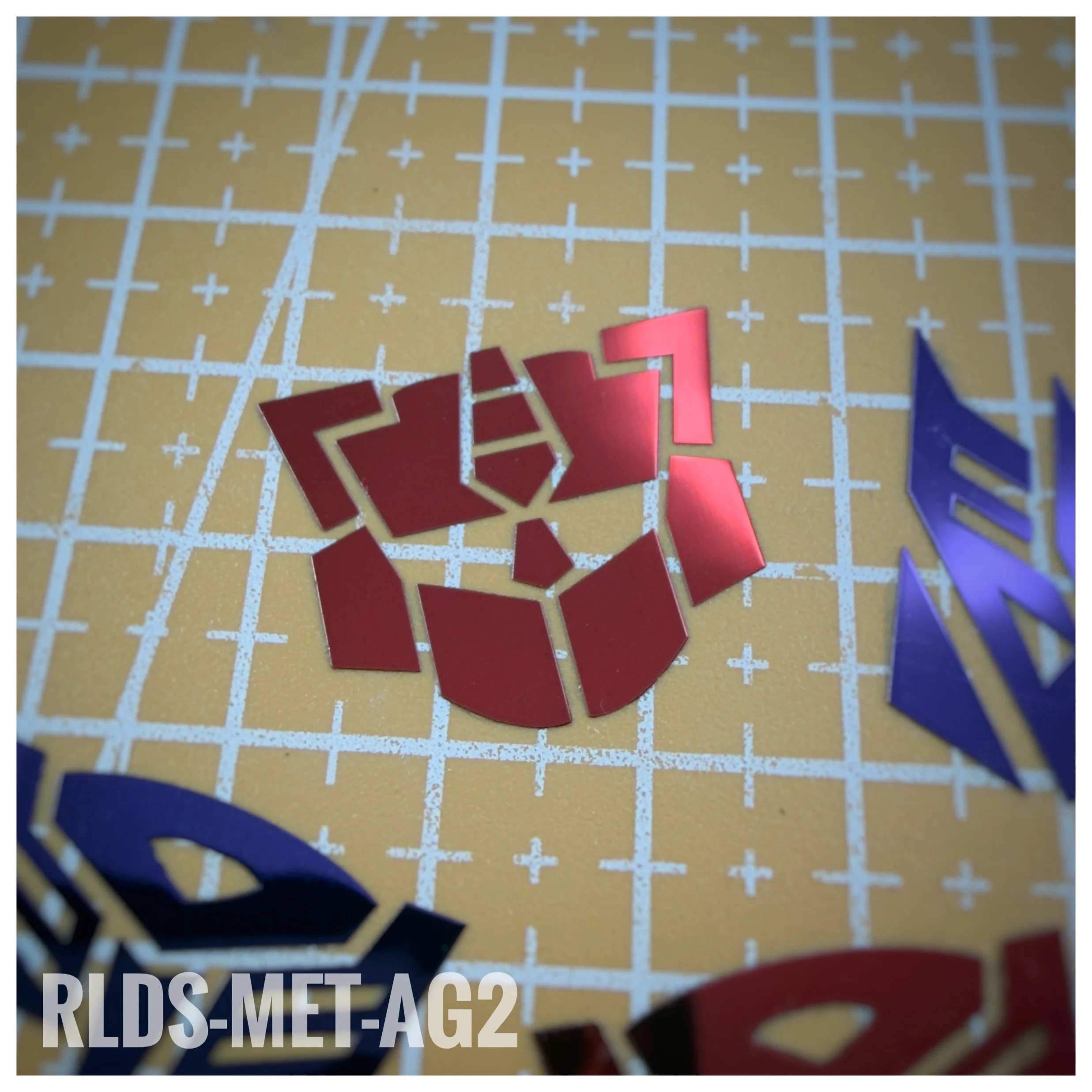 4 x large Metallic G2 Bot dry rub transfers, Metallic Red with Clear background.