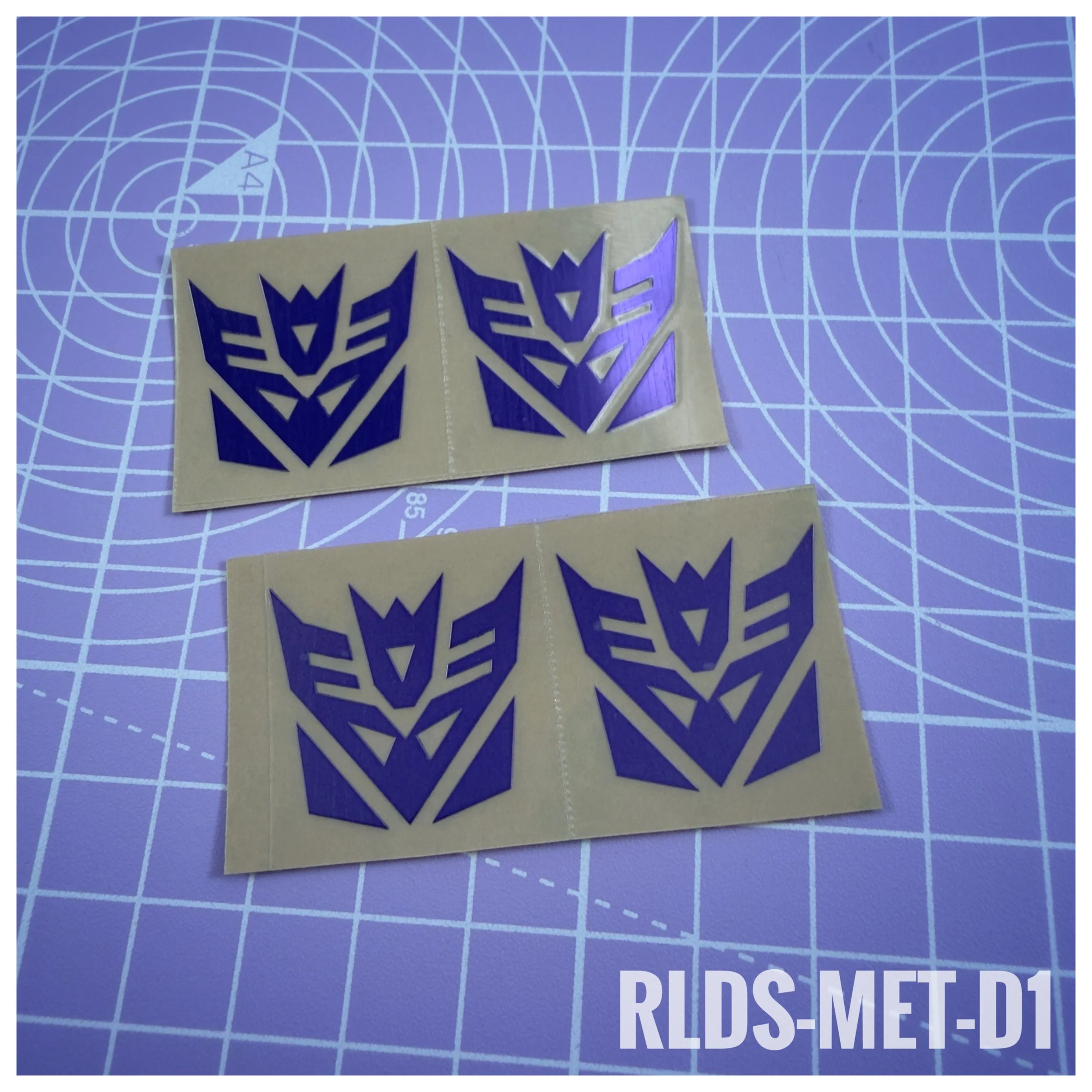 RLDS-MET-D1 - Oversize Metallic Con logos, Purple on Clear