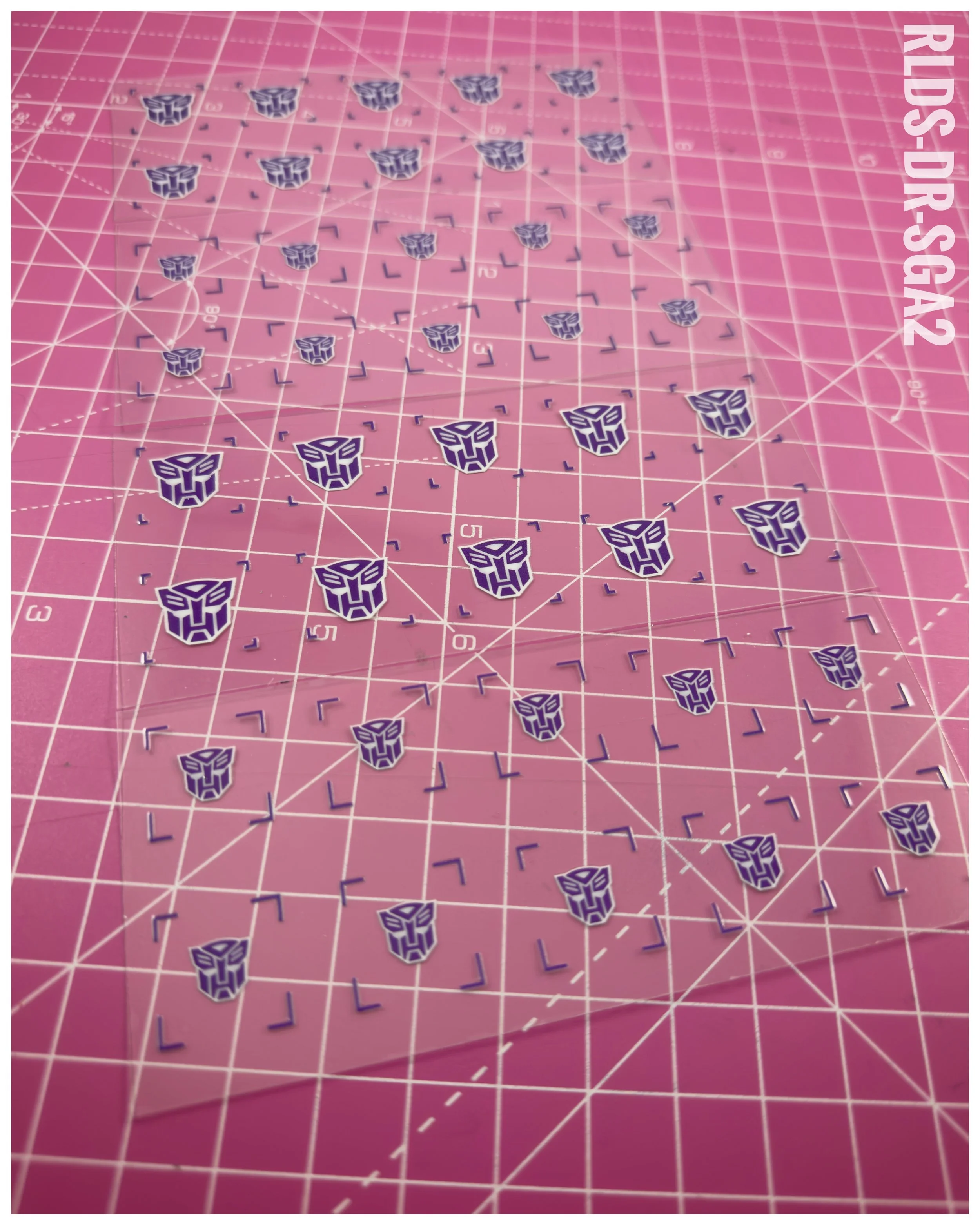 40 x Bot Shattered Glass UV DTF dry rub transfers, Purple with White background.