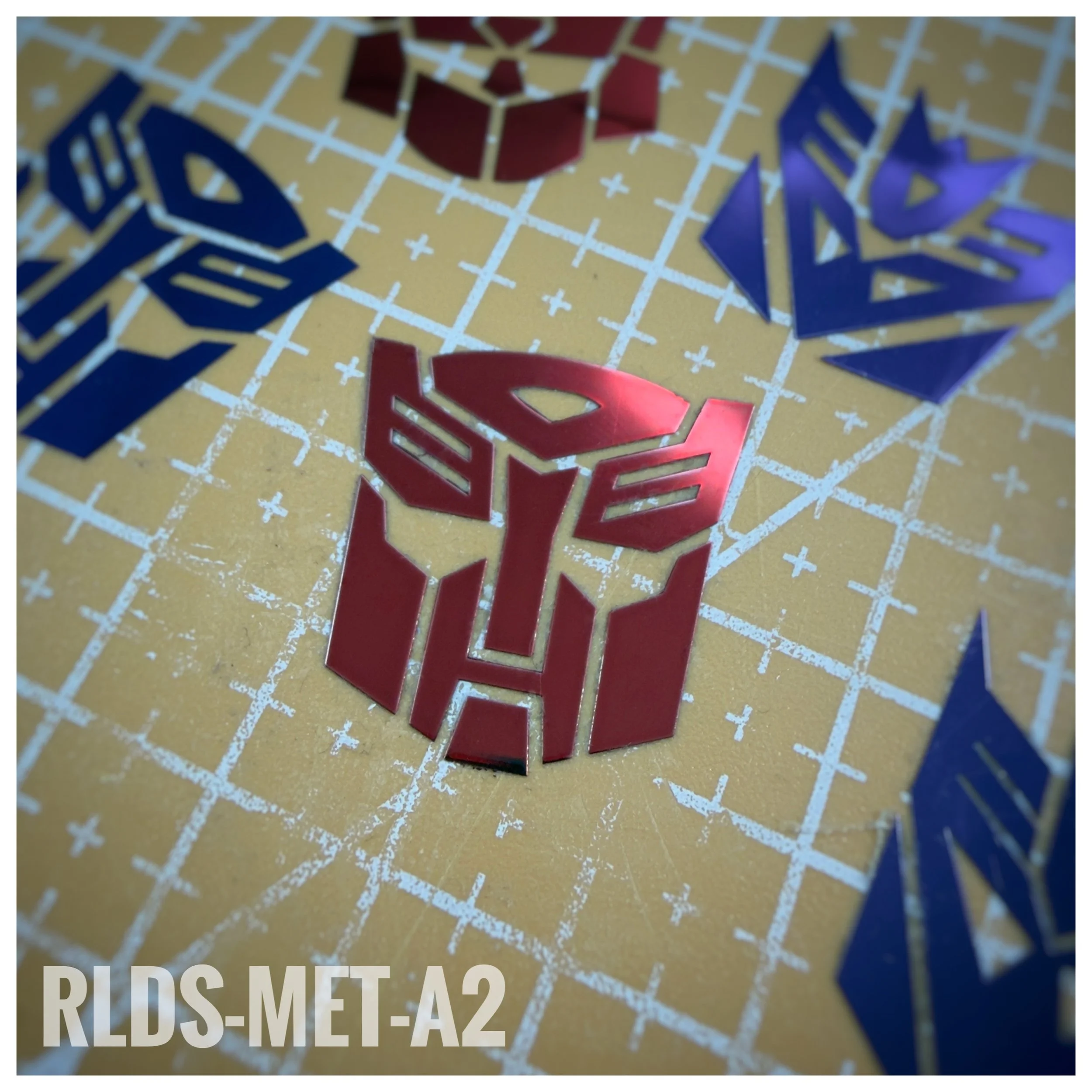 4 x large Metallic Bot dry rub transfers, Toy style, Metallic Red with Clear background.