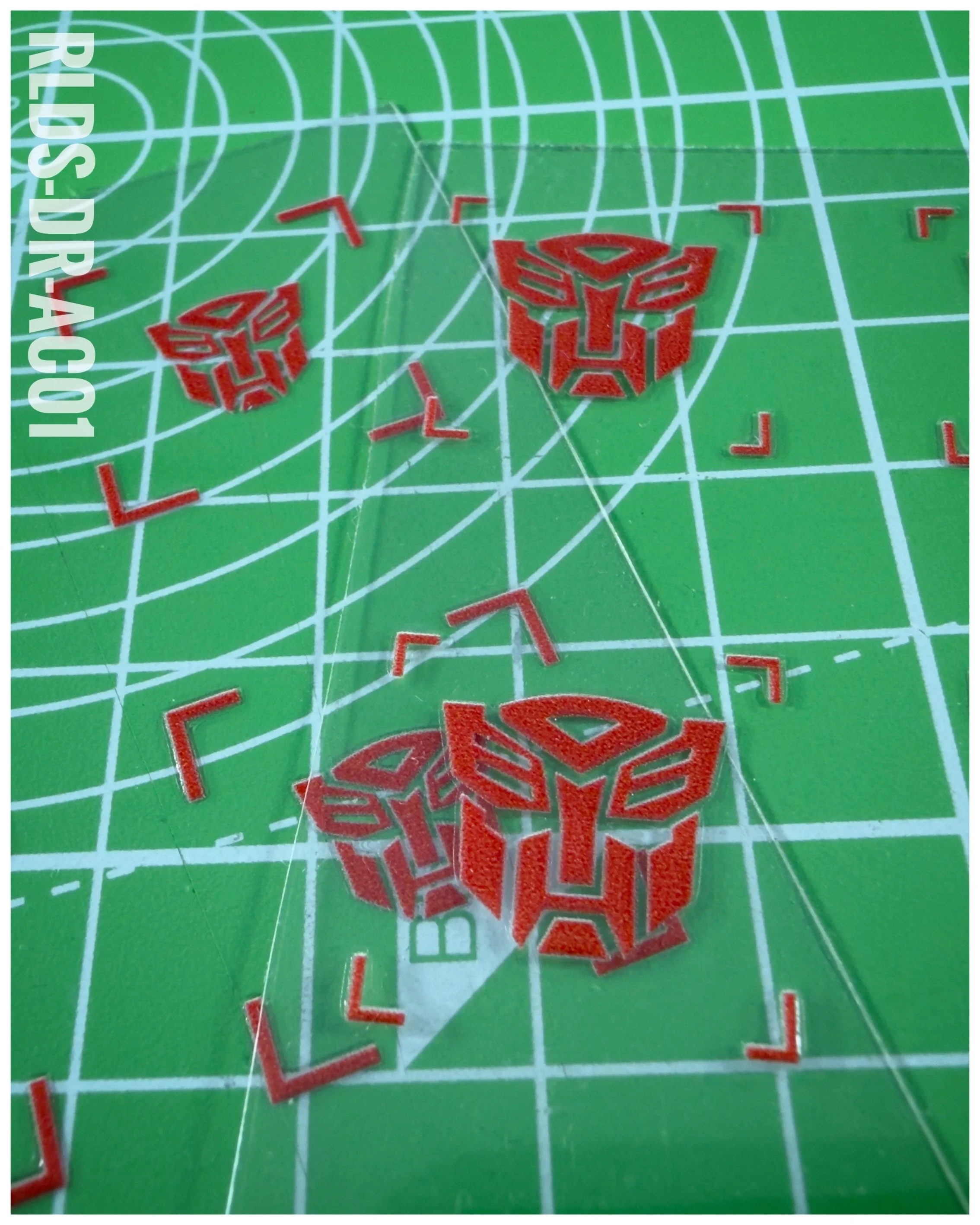40 x Bot UV DTF dry rub transfers, Toon Style, Red with Clear background.