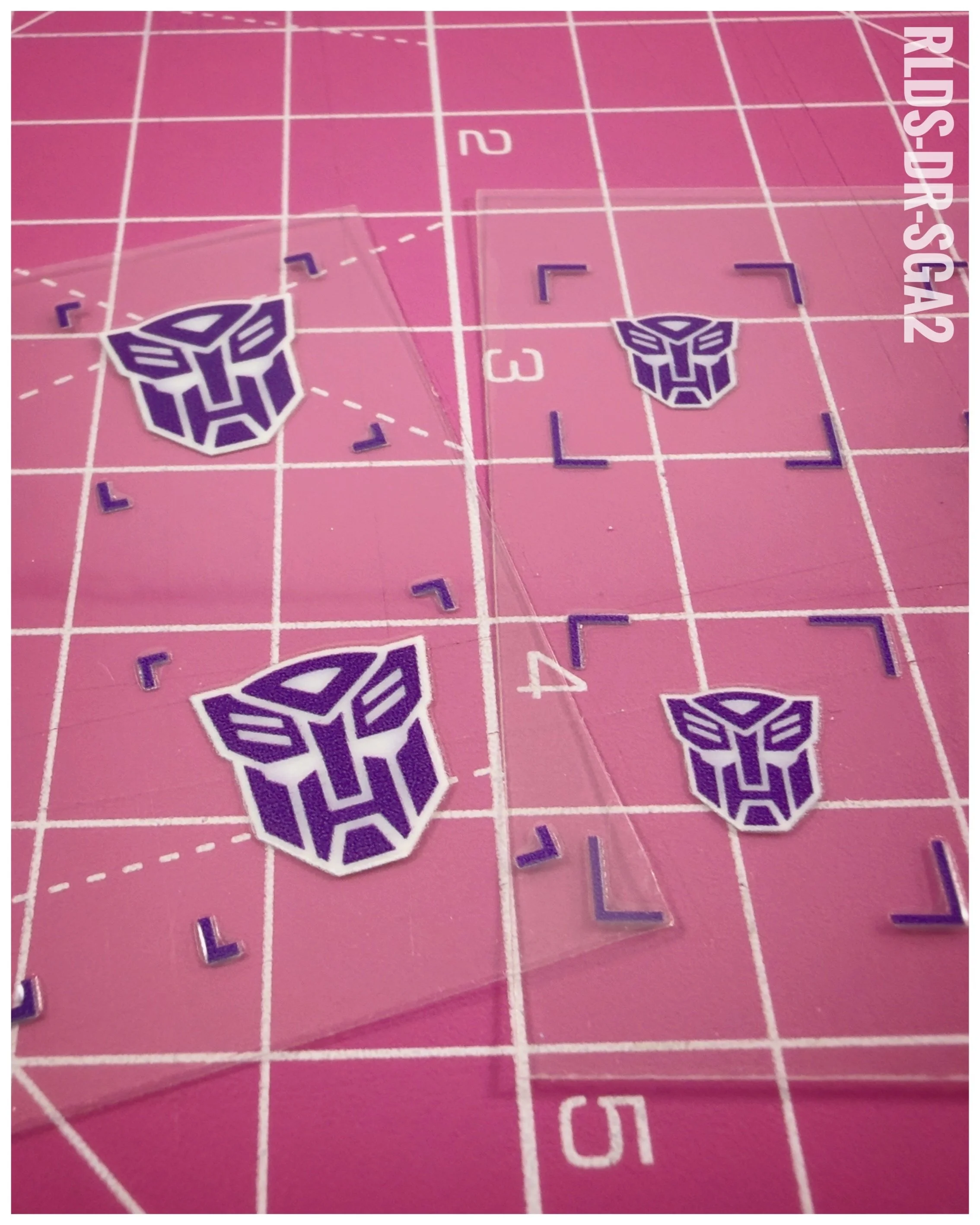40 x Bot Shattered Glass UV DTF dry rub transfers, Purple with White background.