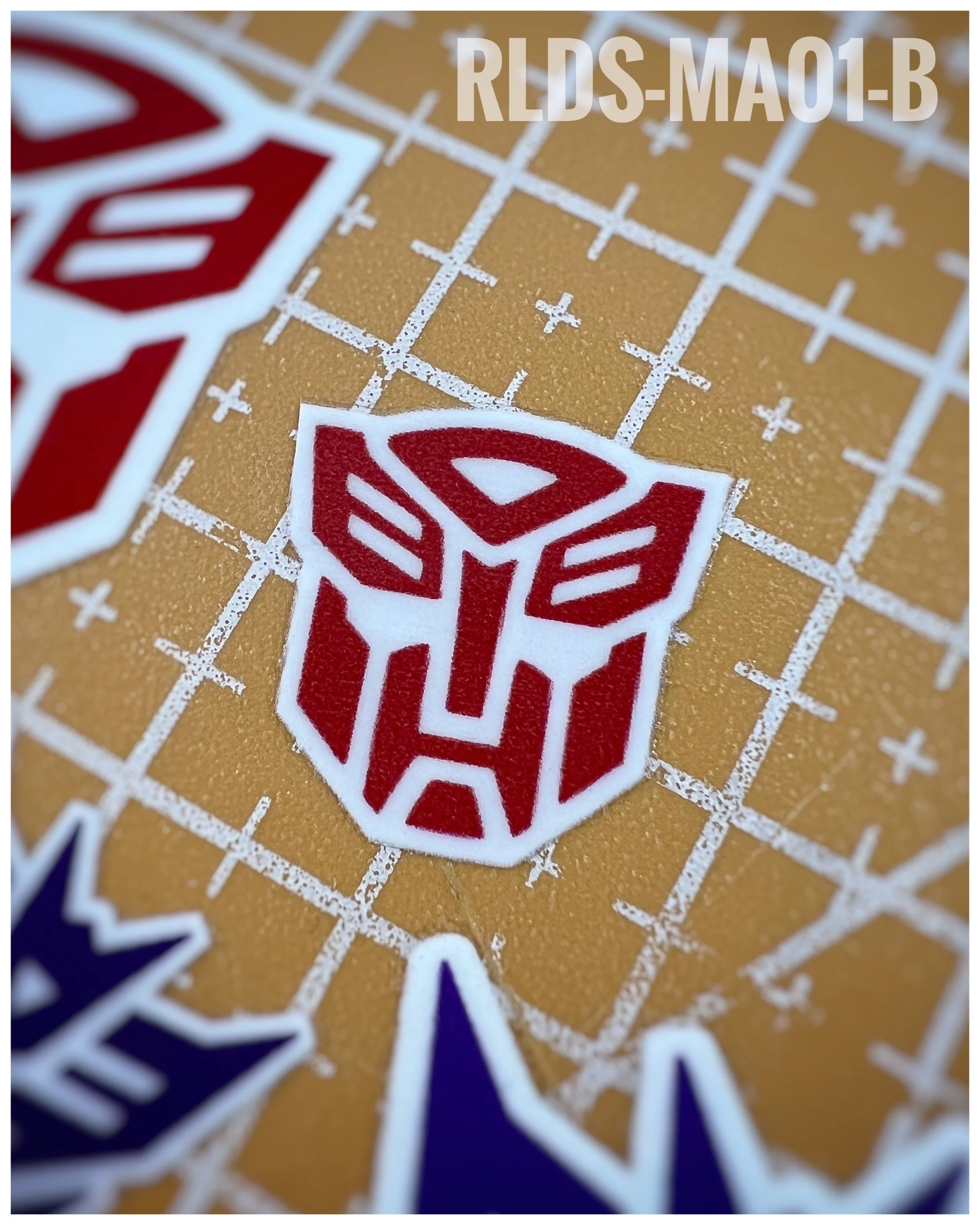 6 x medium toon style Bot dry rub transfers, Red with White background.
