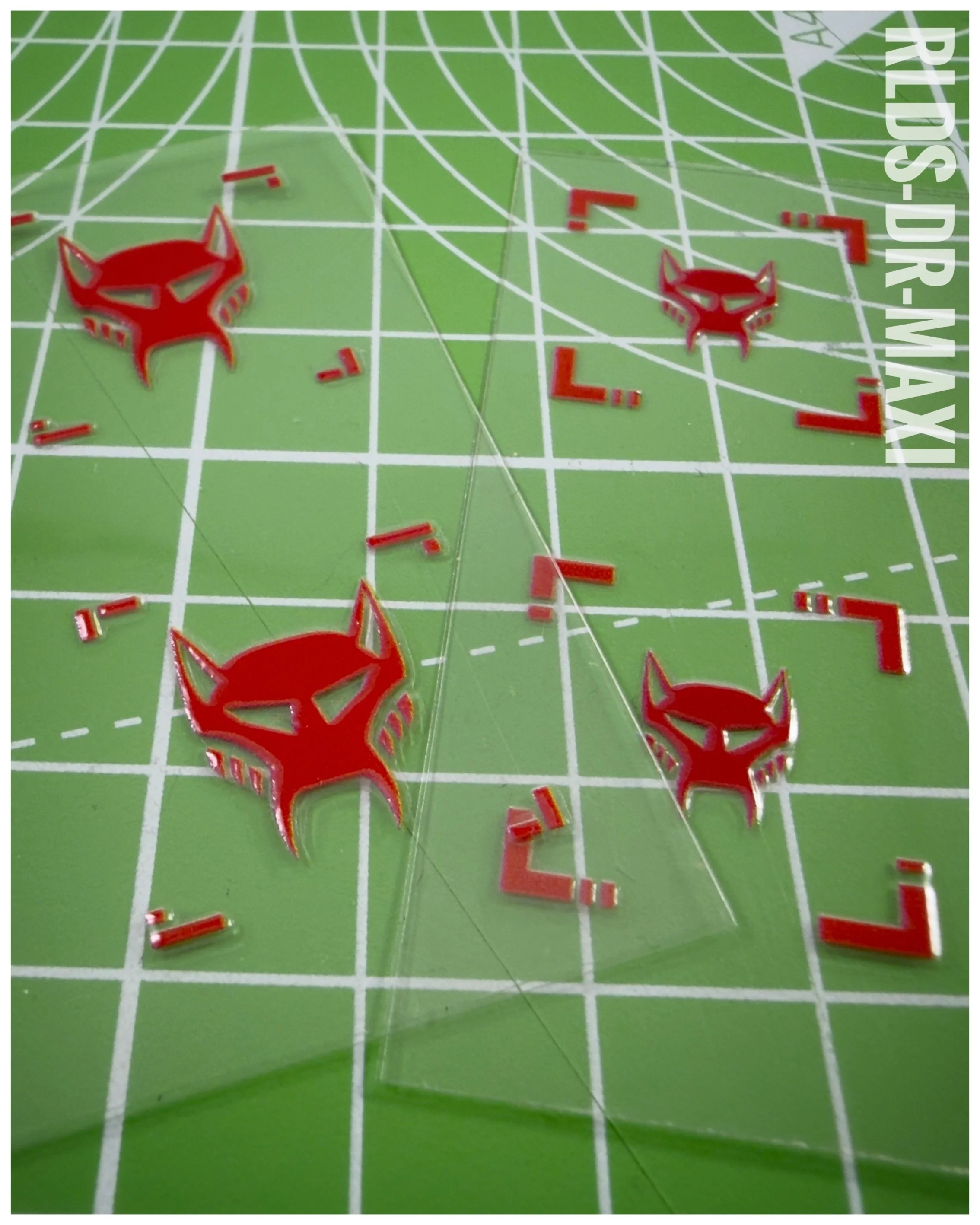 40 x Beast Wars Maximal UV DTF dry rub transfers, Red with Clear background.