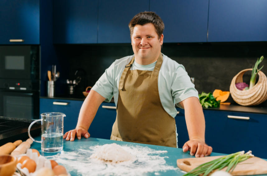Adult with Down syndrome cooking