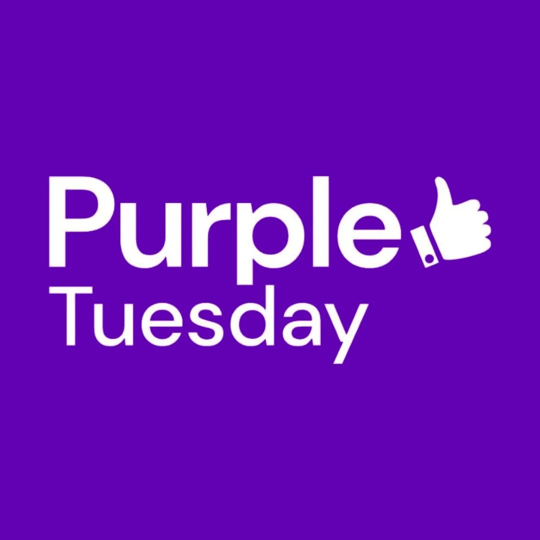Purple background with white text saying 'Purple Tuesday' with a thumbs-up icon.