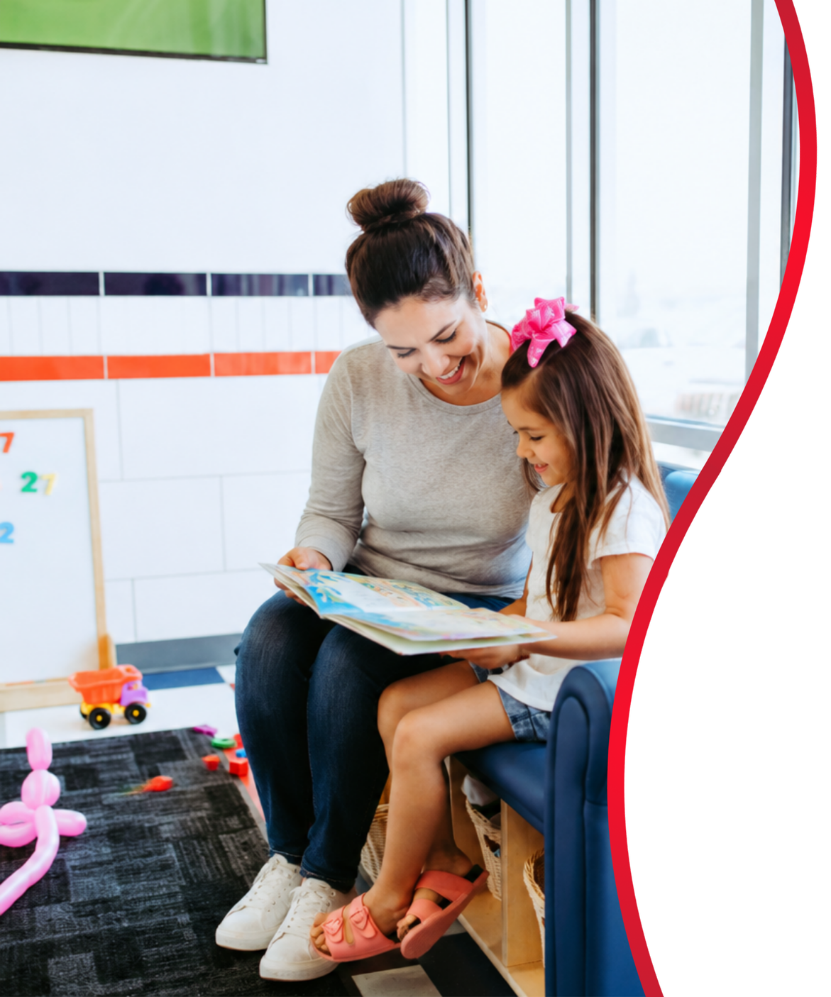 Mother and daughter reading together in a family-friendly laundromat designed to create a welcoming customer experience
