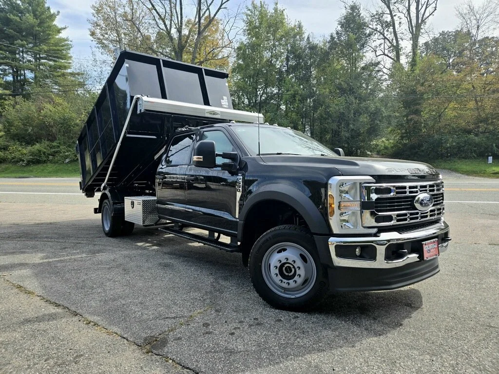 dumpster being off-loaded from a truck