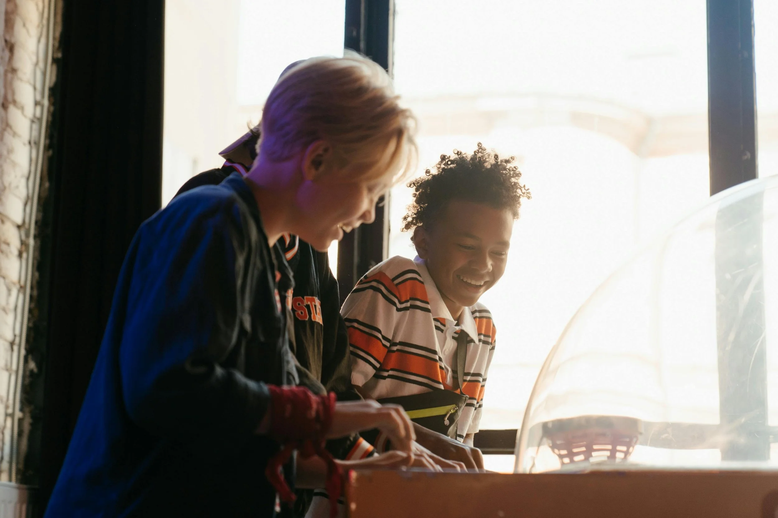 Photo by cottonbro studio: https://www.pexels.com/photo/2-boys-standing-near-glass-window-4835469/