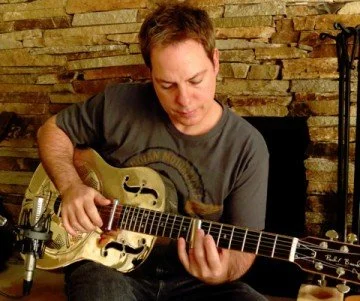 FADE user Kevin Afflack playing a dobro