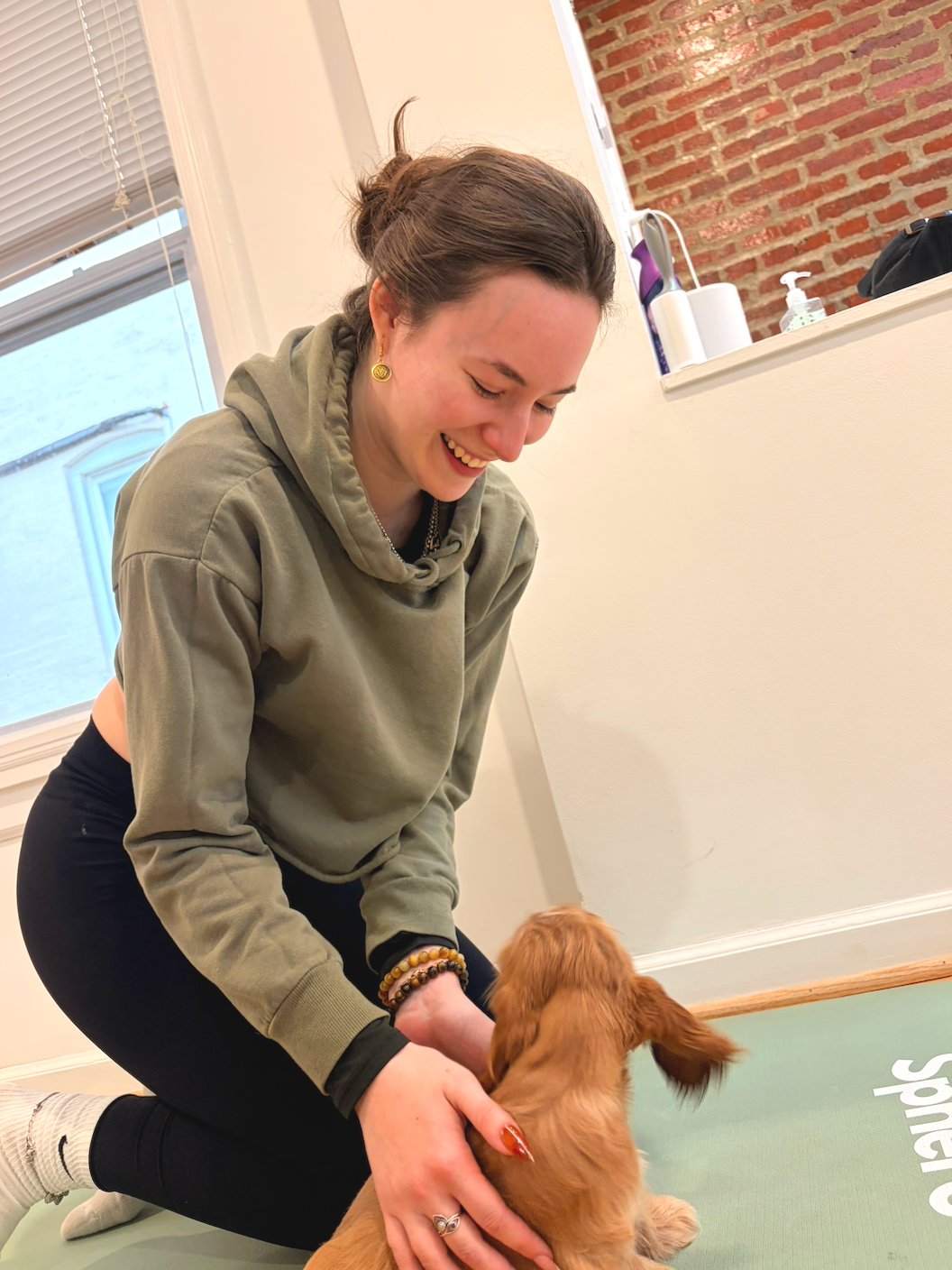 Sophie Conklin with a puppy.