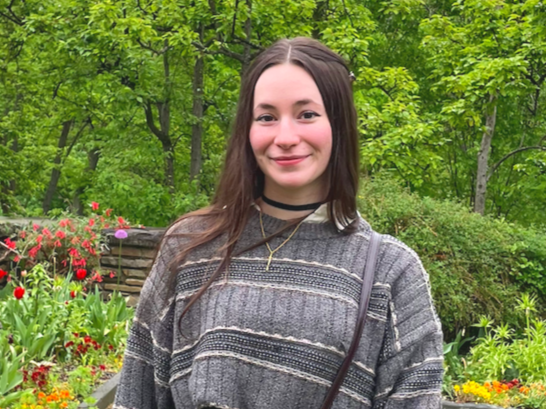 Sophie Conklin in a garden.