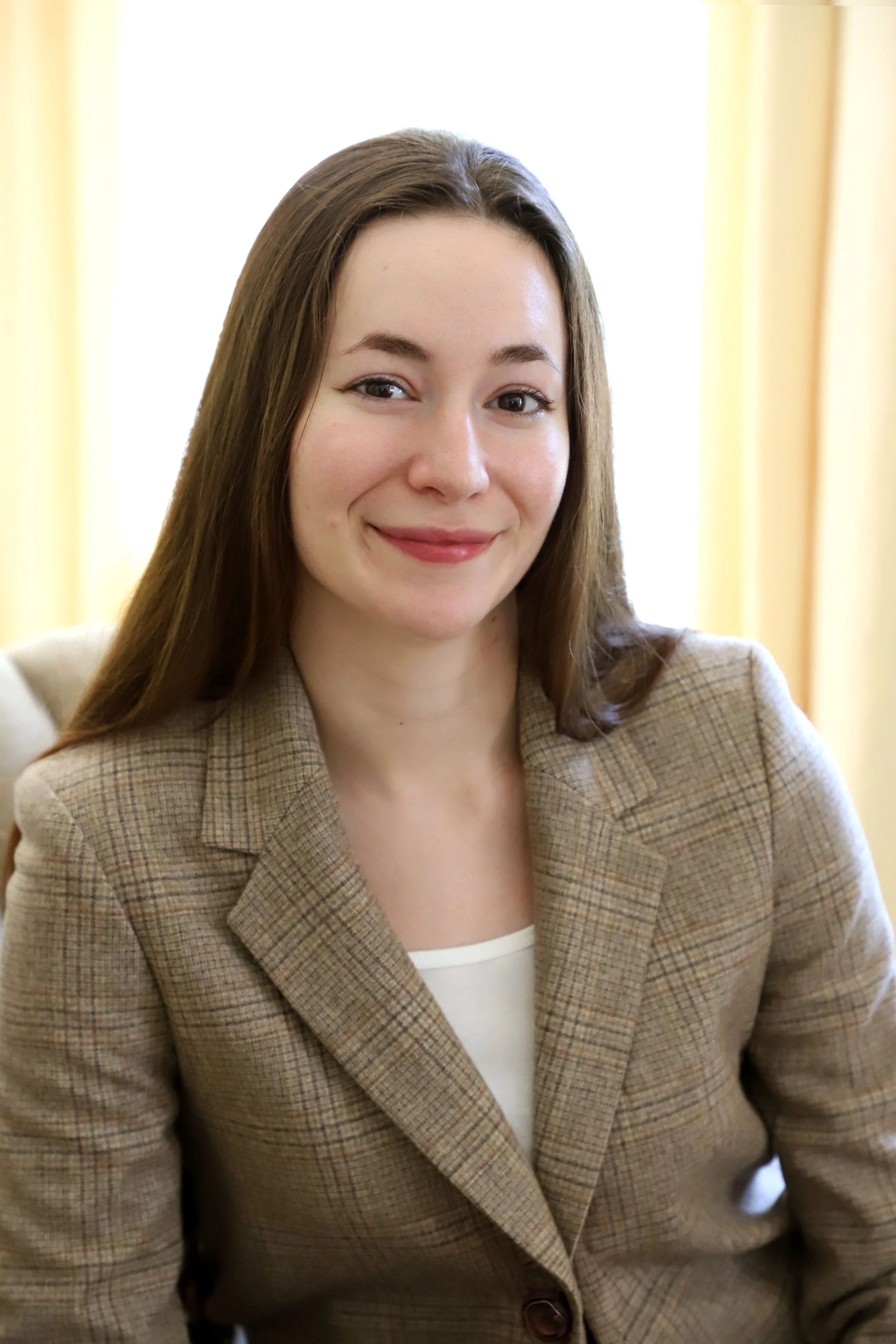 Sophie Conklin, LCSW headshot in beige jacket