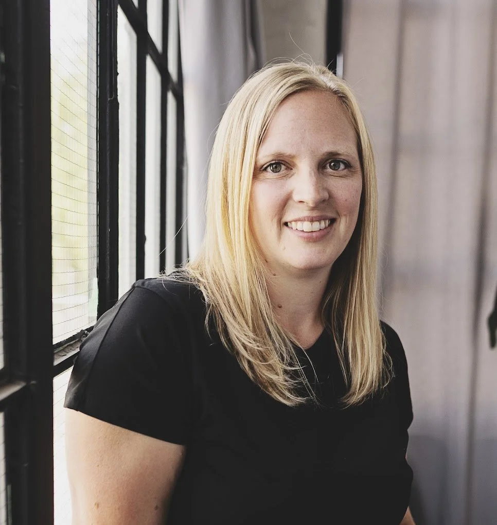 Massage Therapist smiling at camera