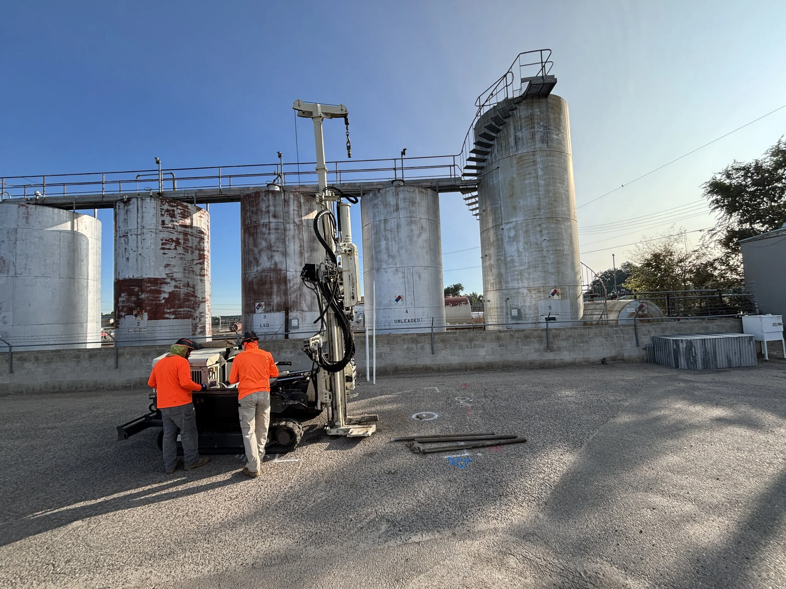 Soil boring in progress beside aboveground fuel storage tanks